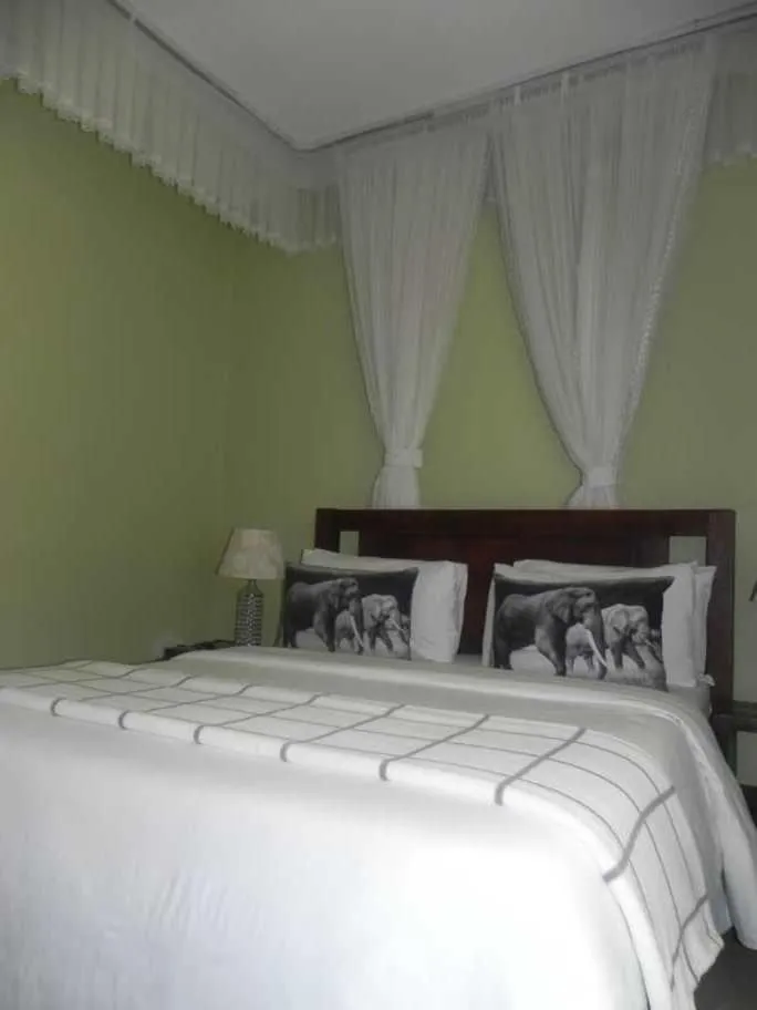 Bed in MAMIKKI Hotel Apartments