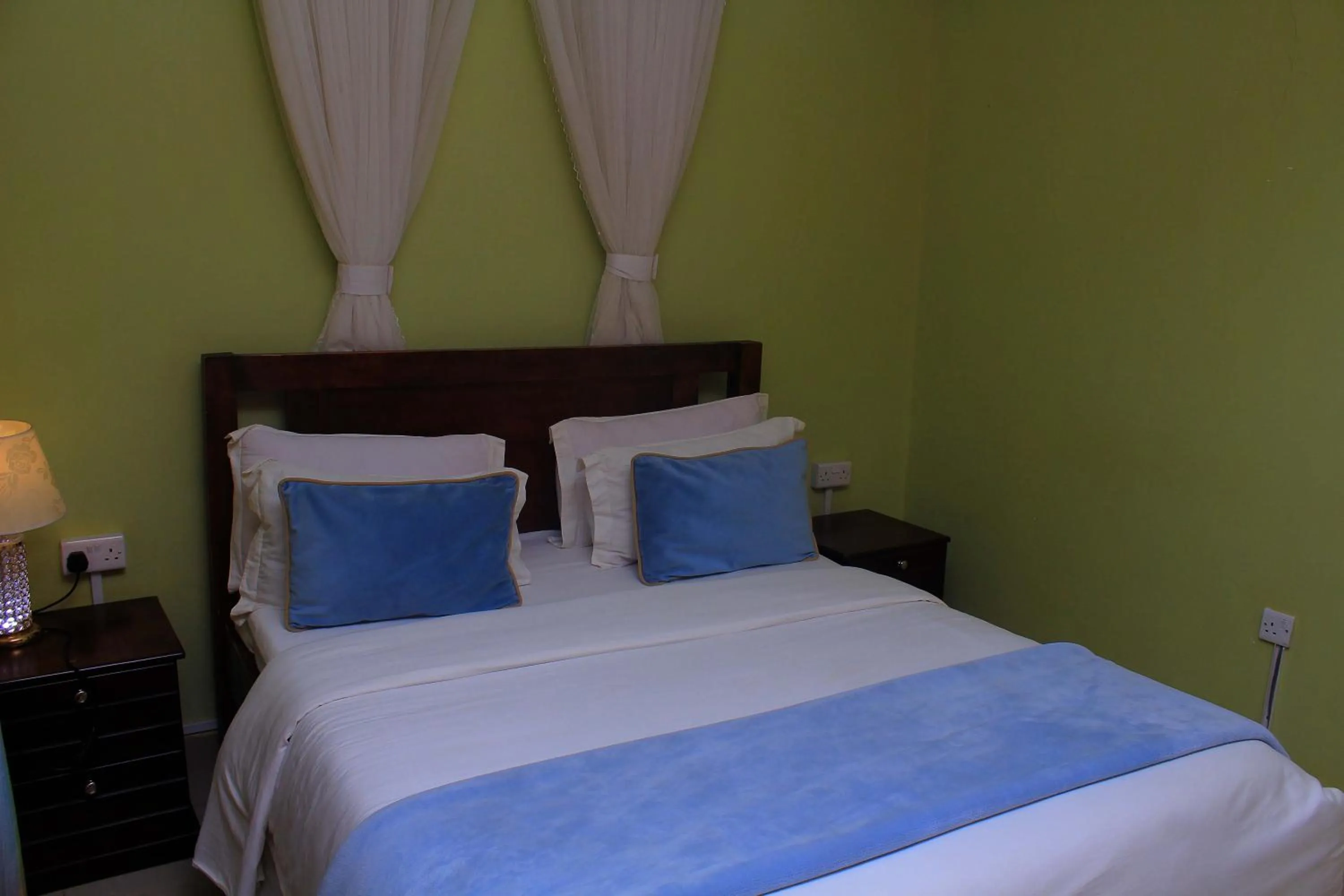 Bed in MAMIKKI Hotel Apartments