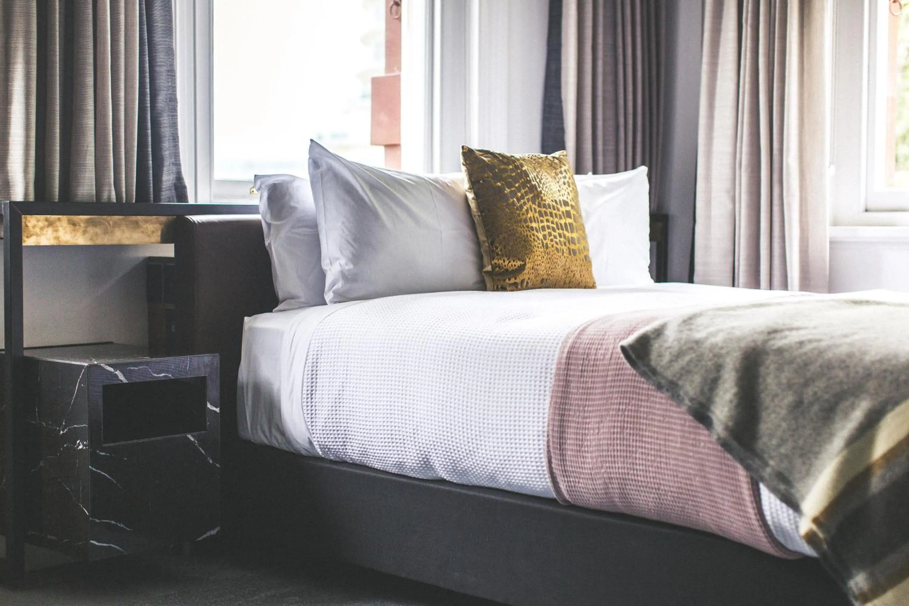 Bed in Clarence Boutique Hotel