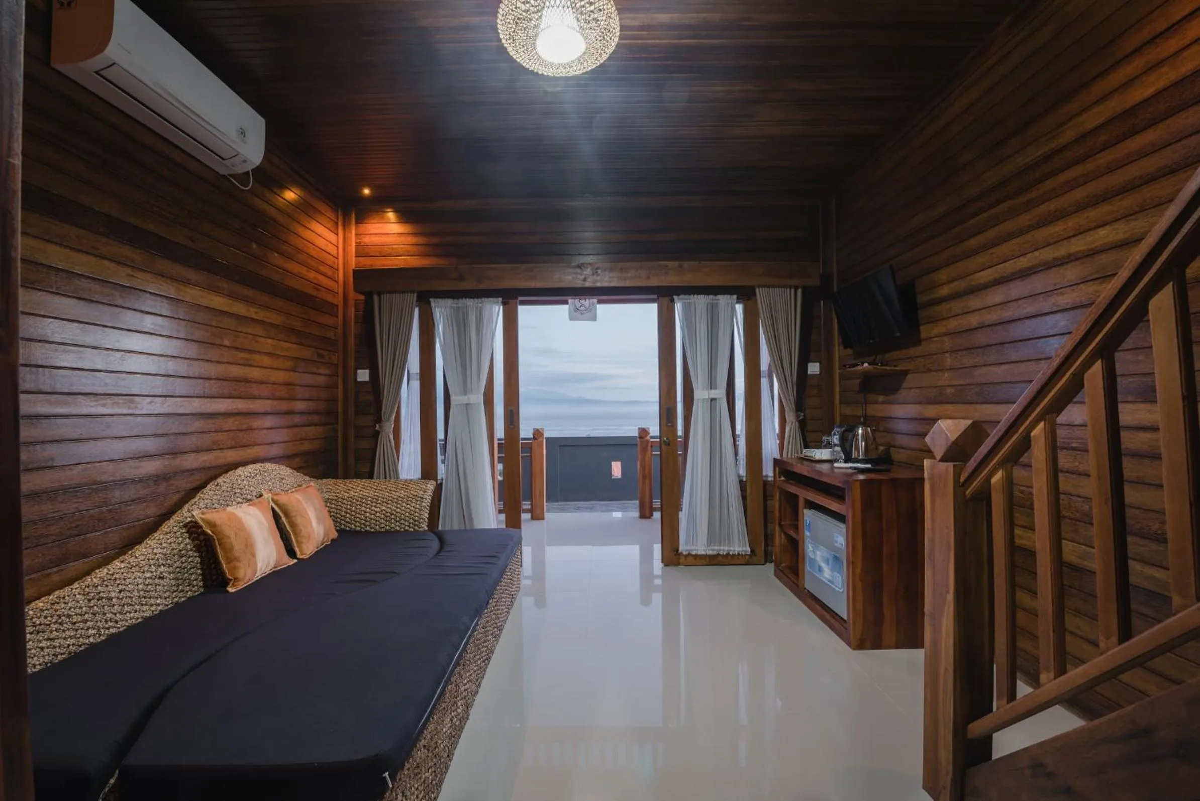 Living room, Bed in Daphila Cottage