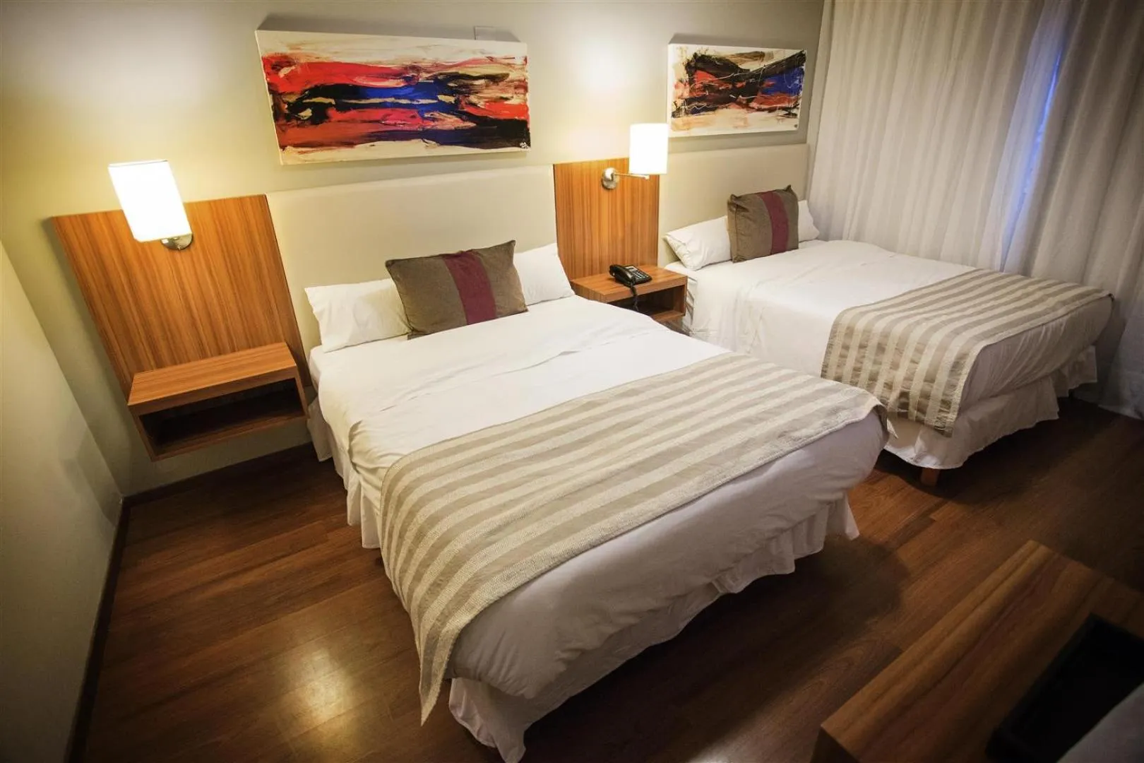 Bed in Hotel Bicentenario Suites & Spa
