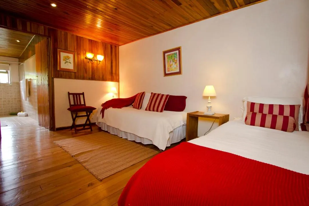 Photo of the whole room, Bed in Poas Volcano Lodge