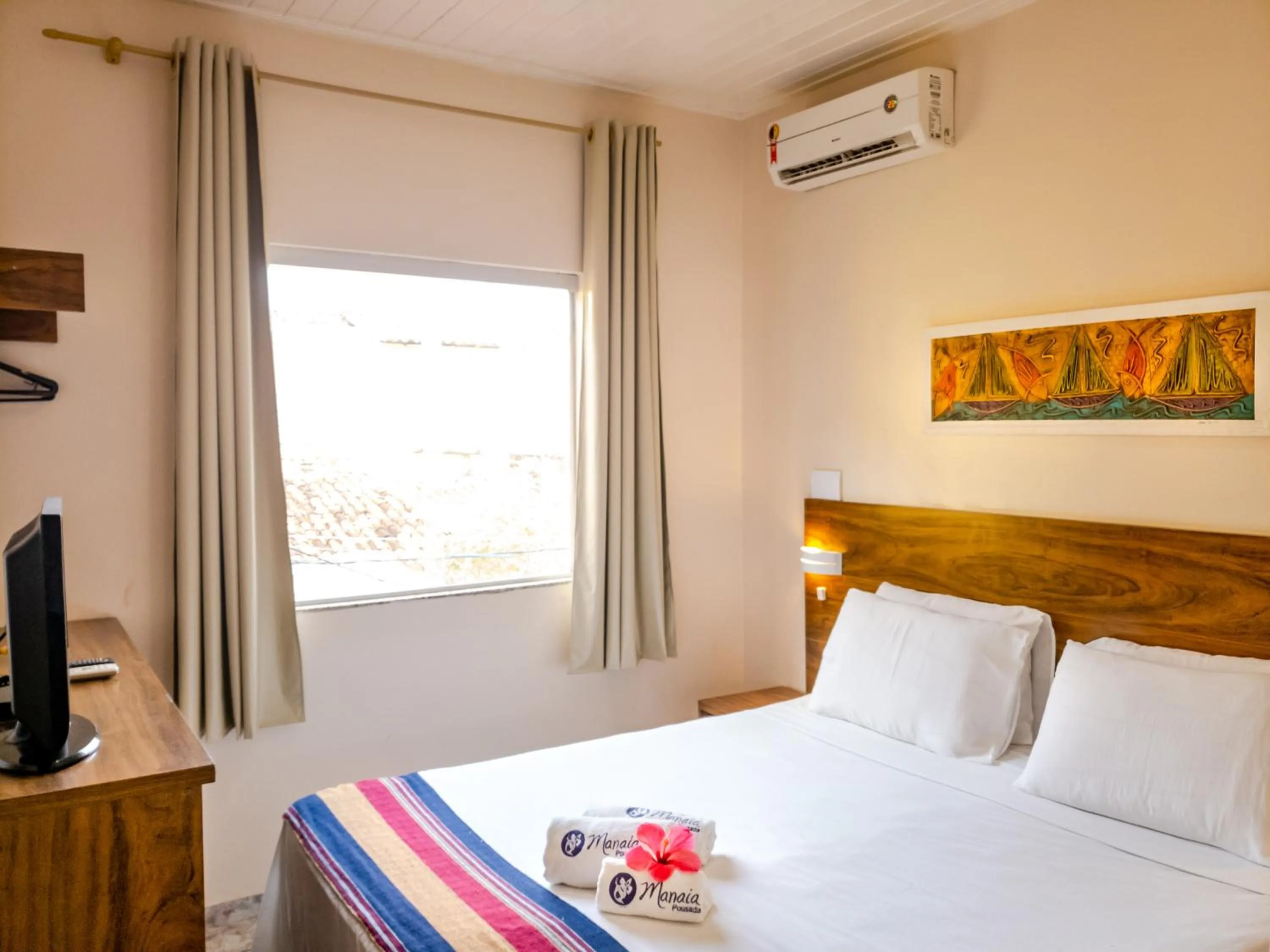 Bed in Pousada Manaia