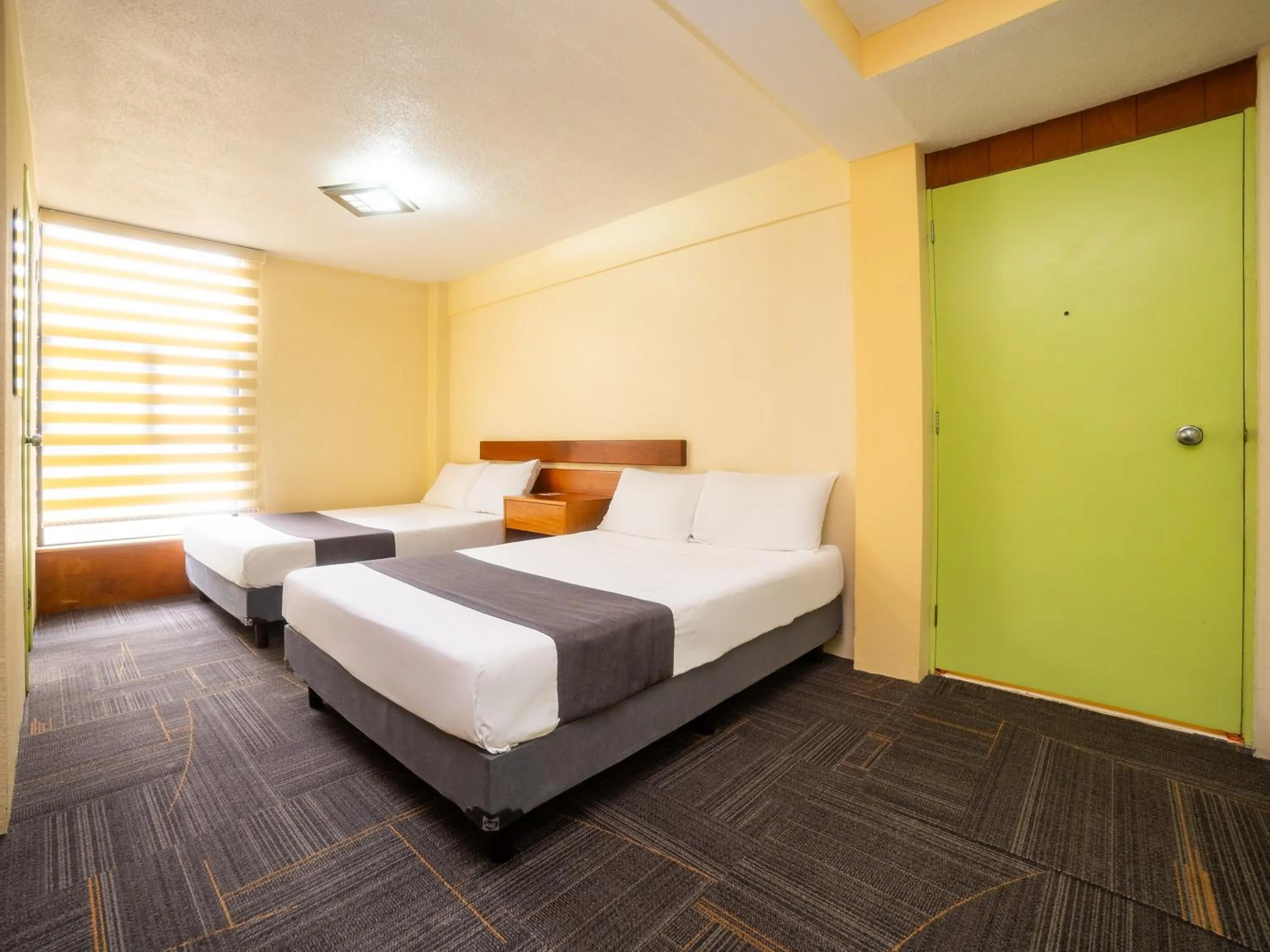 Bedroom, Bed in Capital O Hotel Suites Marne, Mexico City