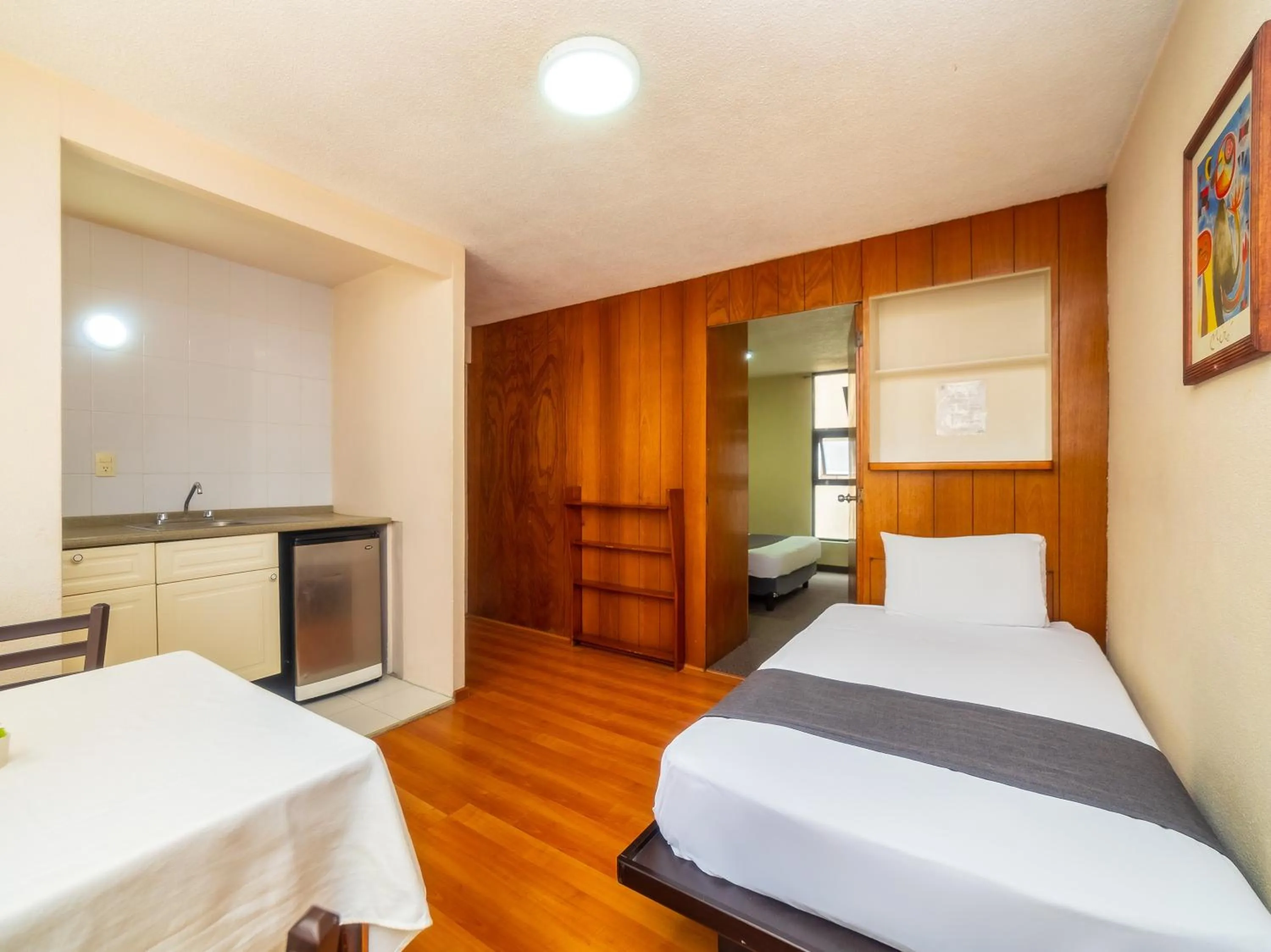 Bedroom, Bed in Capital O Hotel Suites Marne, Mexico City