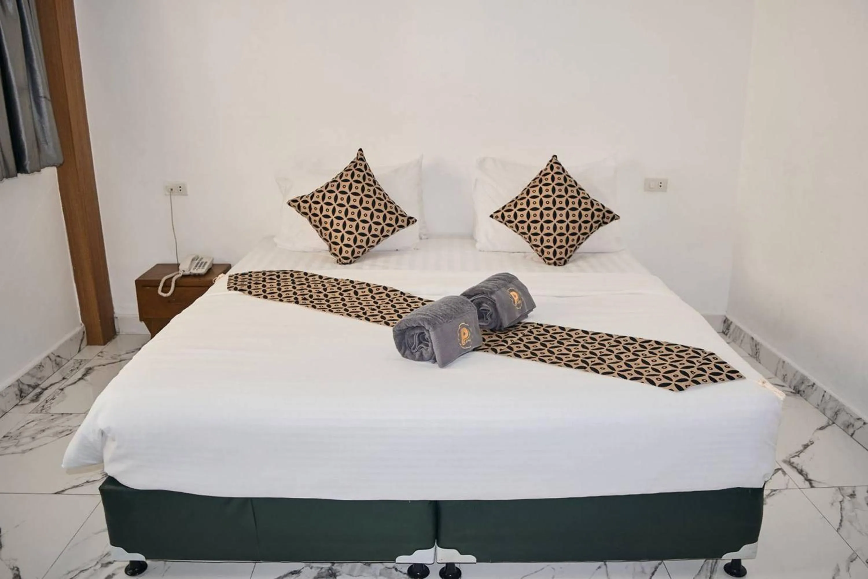 Bed in Papa Ji Hotel and Restaurant