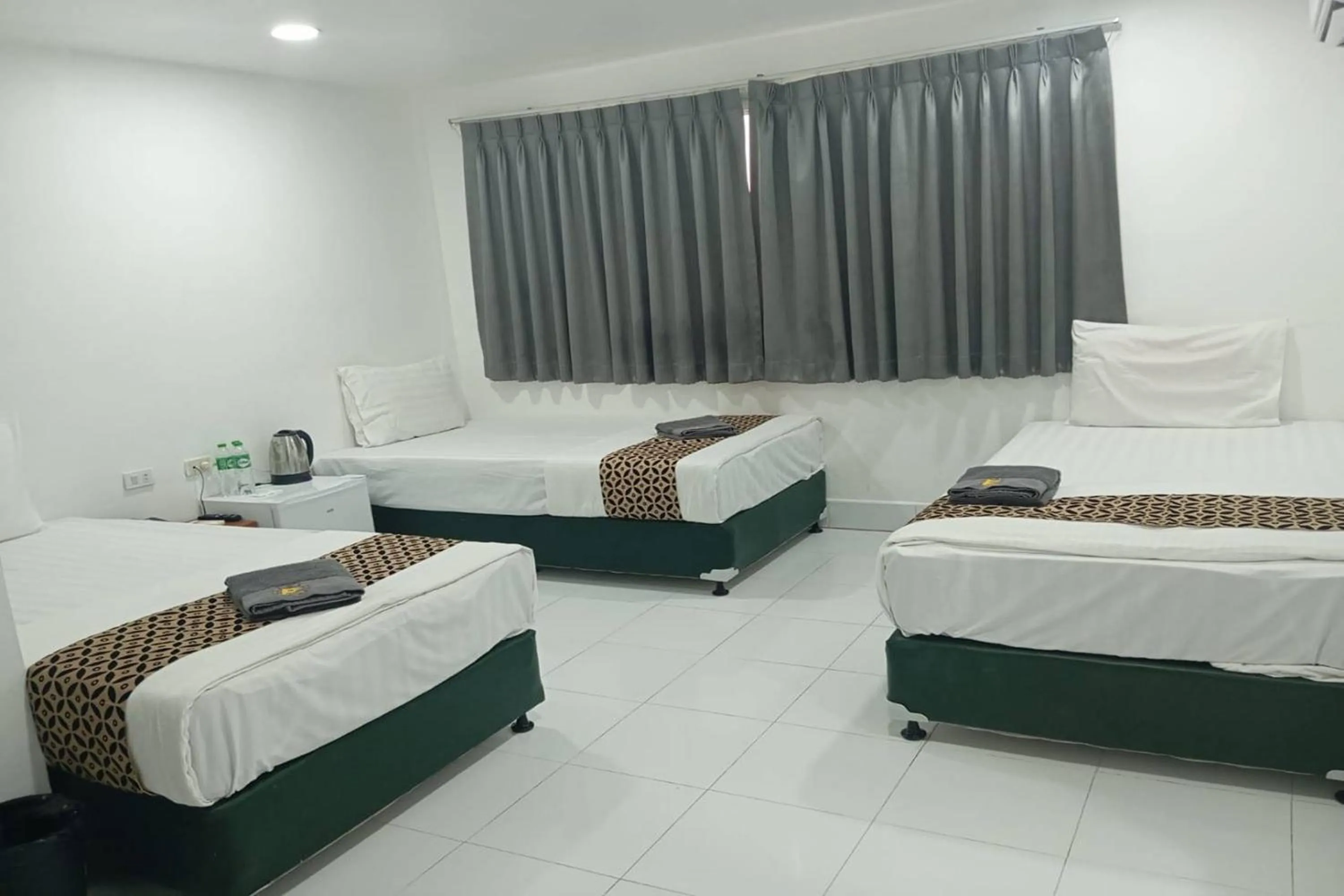 Bed in Papa Ji Hotel and Restaurant