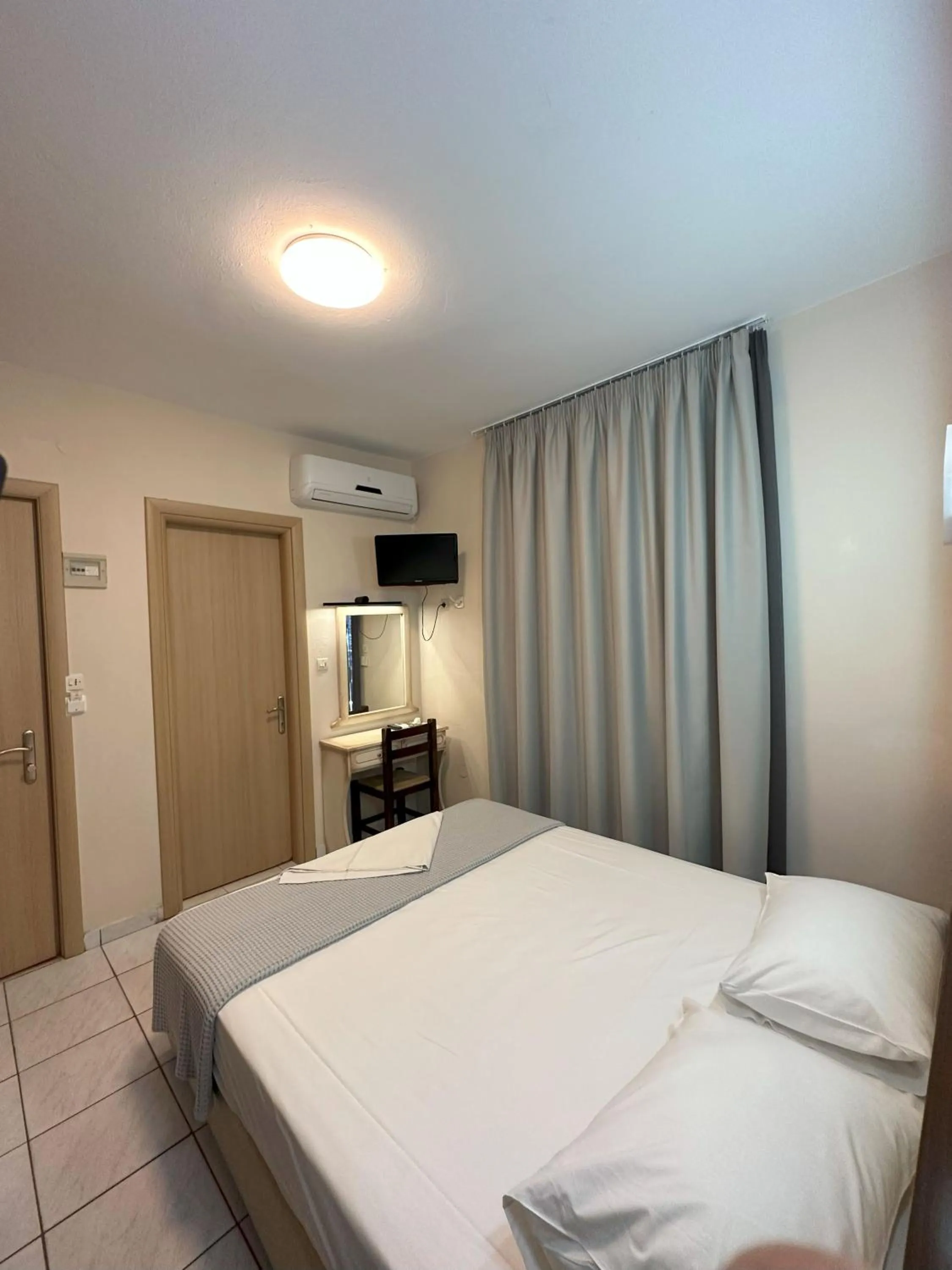 Bed in Hotel Afrodite