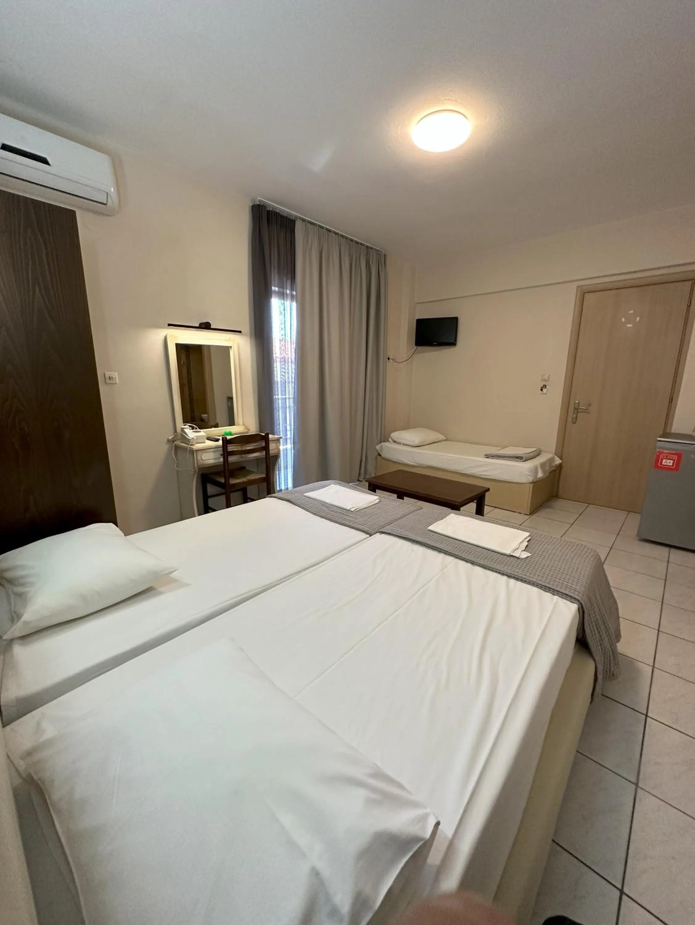 Bed in Hotel Afrodite