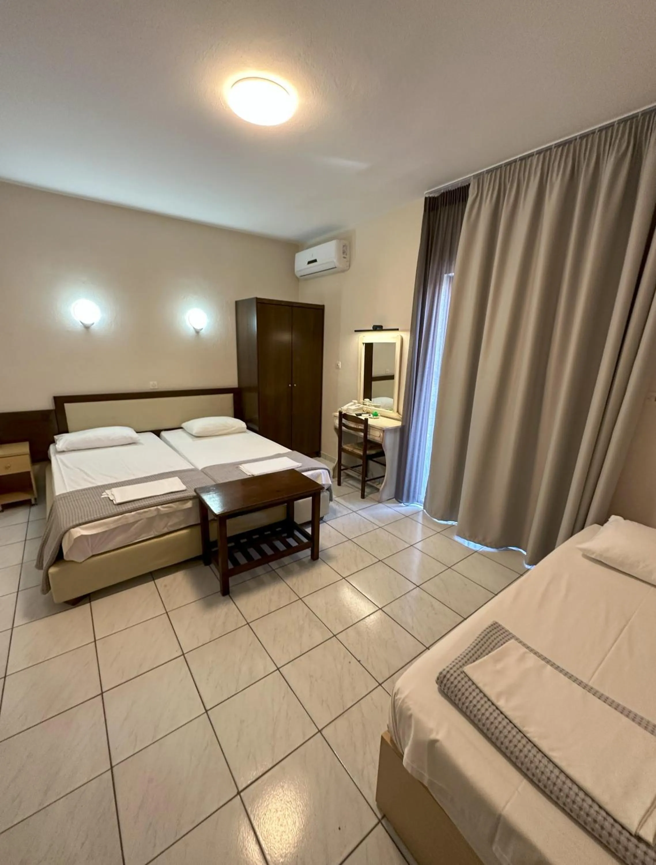 Bed in Hotel Afrodite