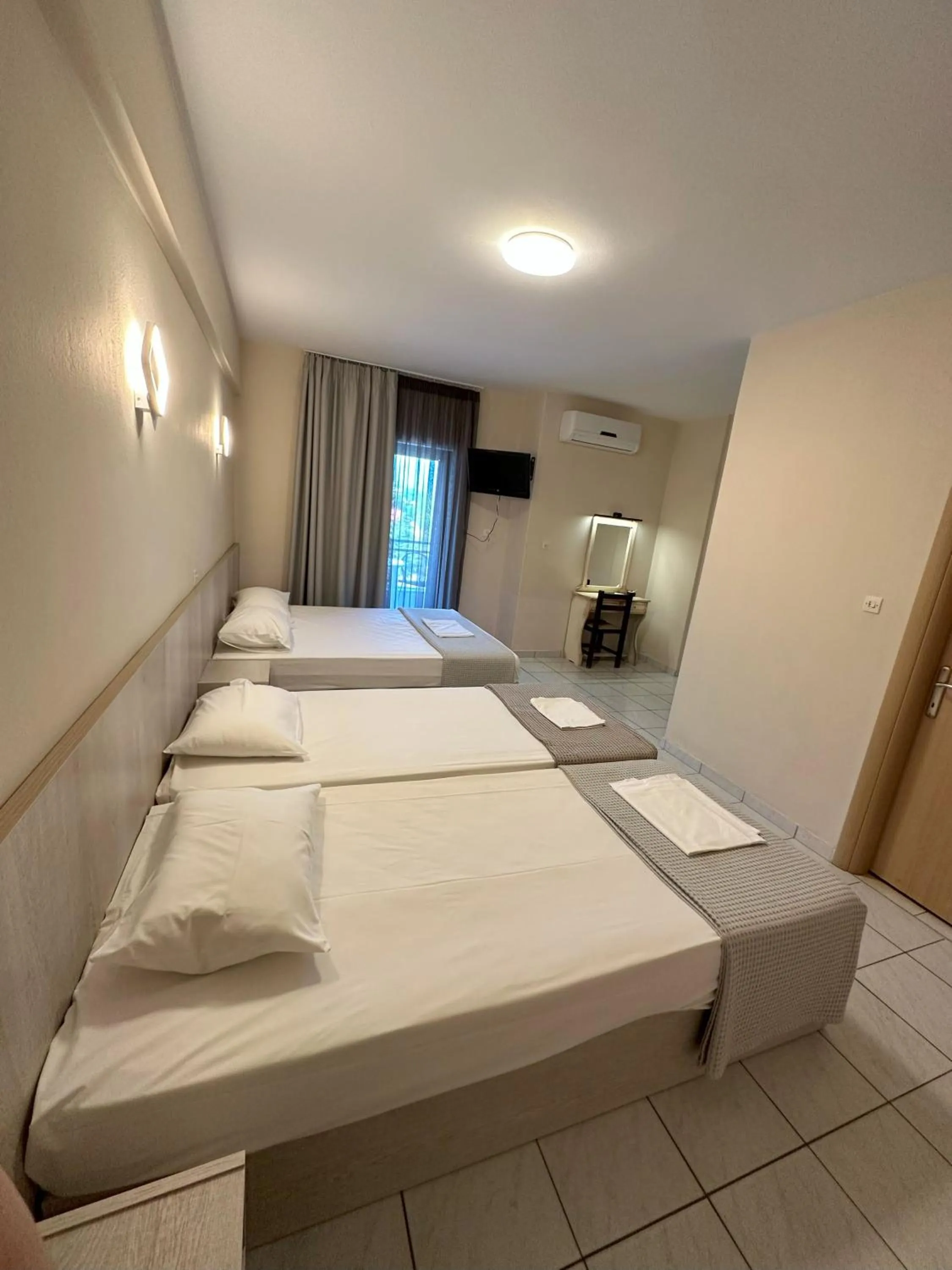 Bed in Hotel Afrodite