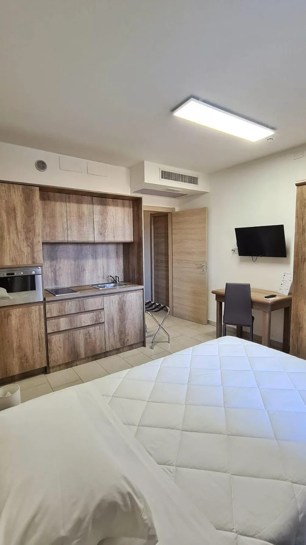 Bed in Mansio Residence & Hotel