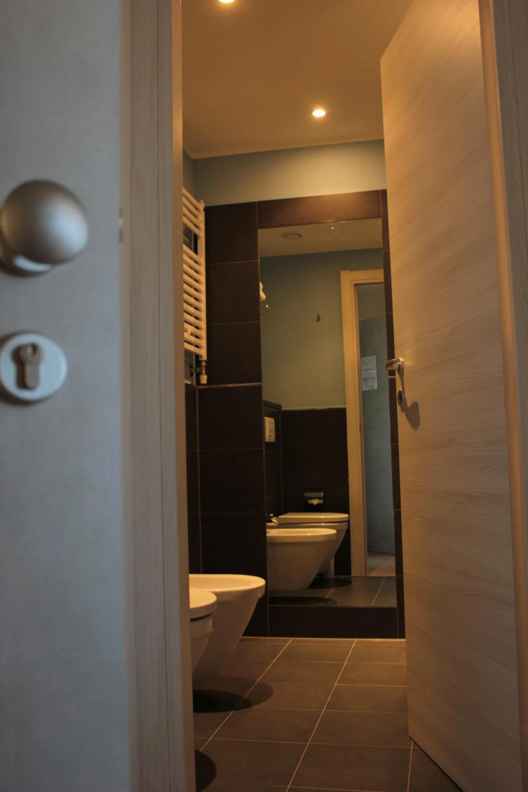 Toilet in Mansio Residence & Hotel