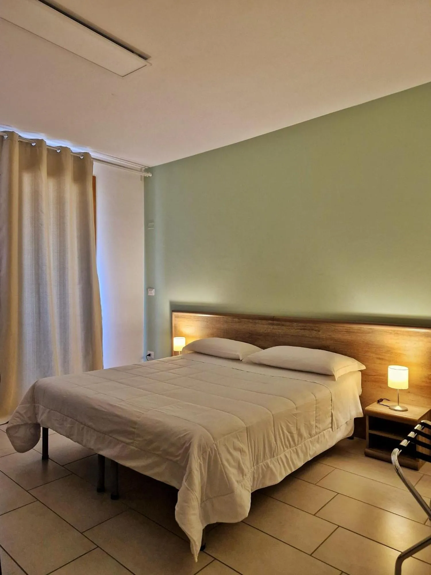 Bed in Mansio Residence & Hotel