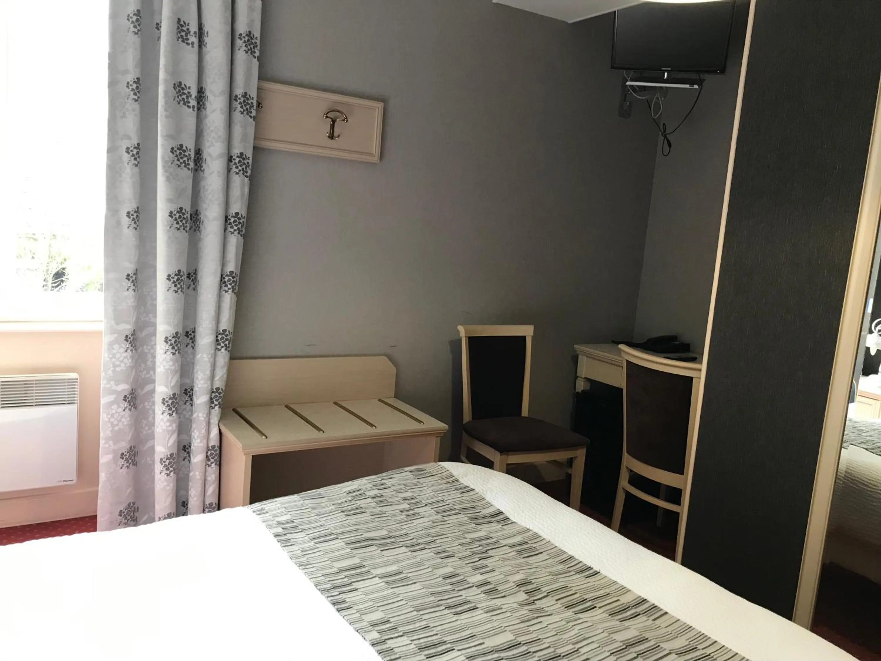 Bed in Logis hotel Saint-Joseph