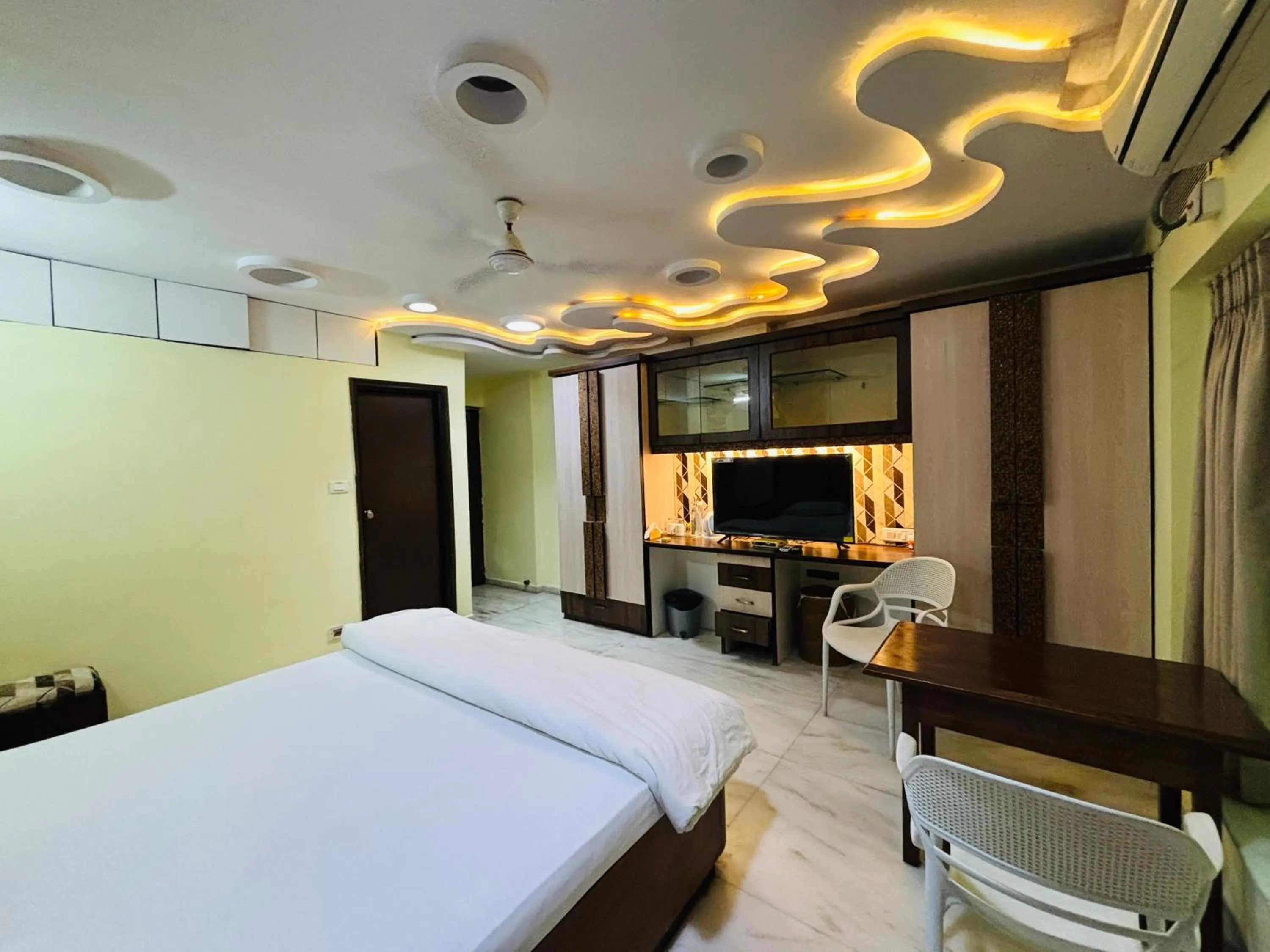 Bed in Royal Palms Luxury Service Apartment