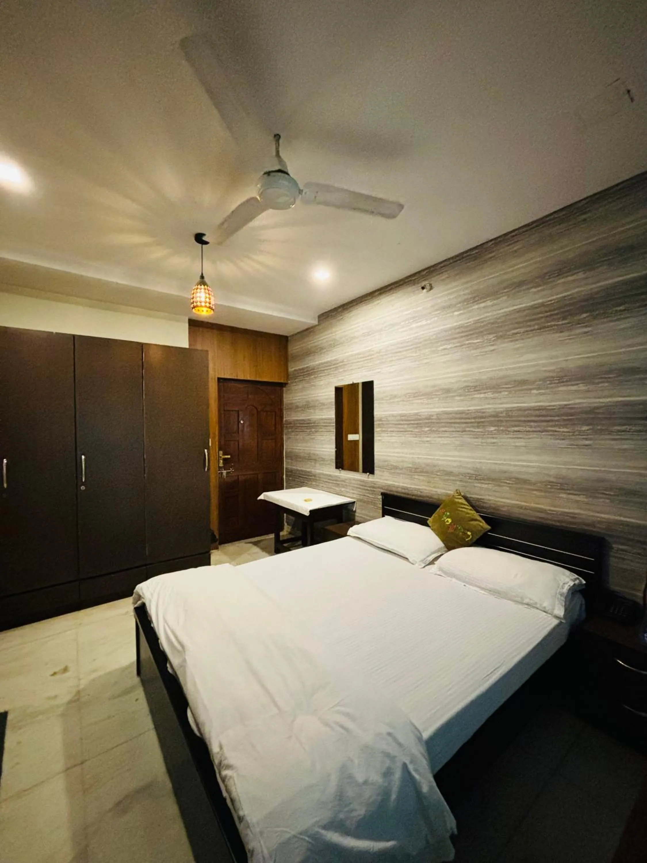 Bed in Royal Palms Luxury Service Apartment