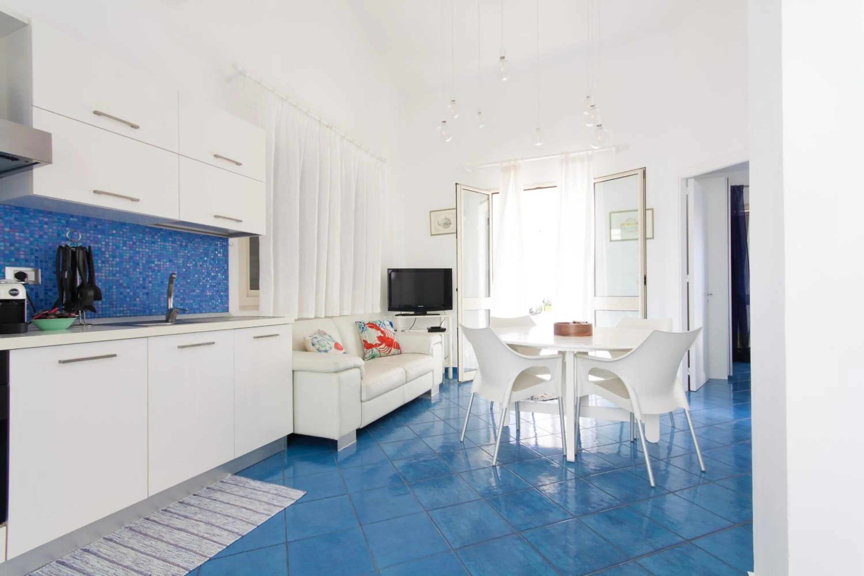 Kitchen or kitchenette in Amira Beach Villa by Le Dhome Sicily