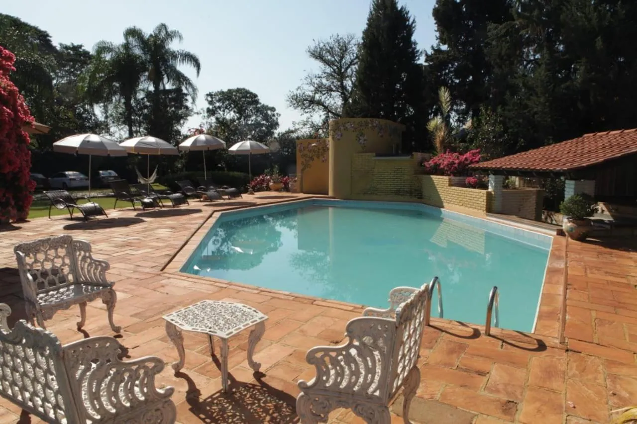 Swimming pool in Hotel Pousada Chalé das Flores