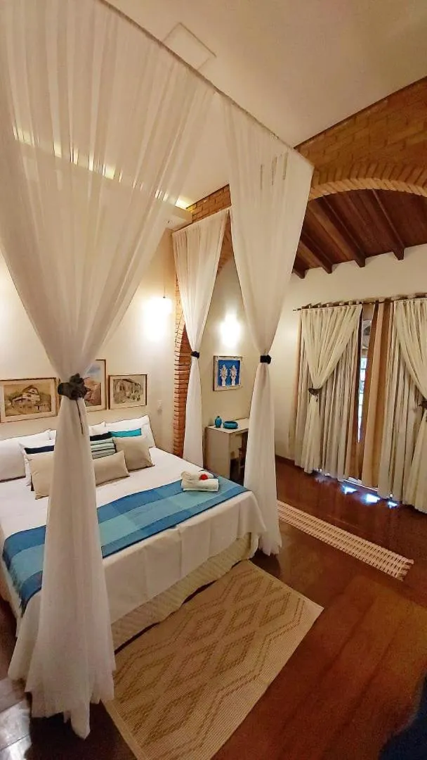 Bed in Hotel Pousada Chalé das Flores