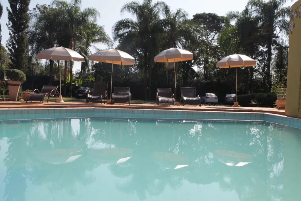 Swimming pool in Hotel Pousada Chalé das Flores