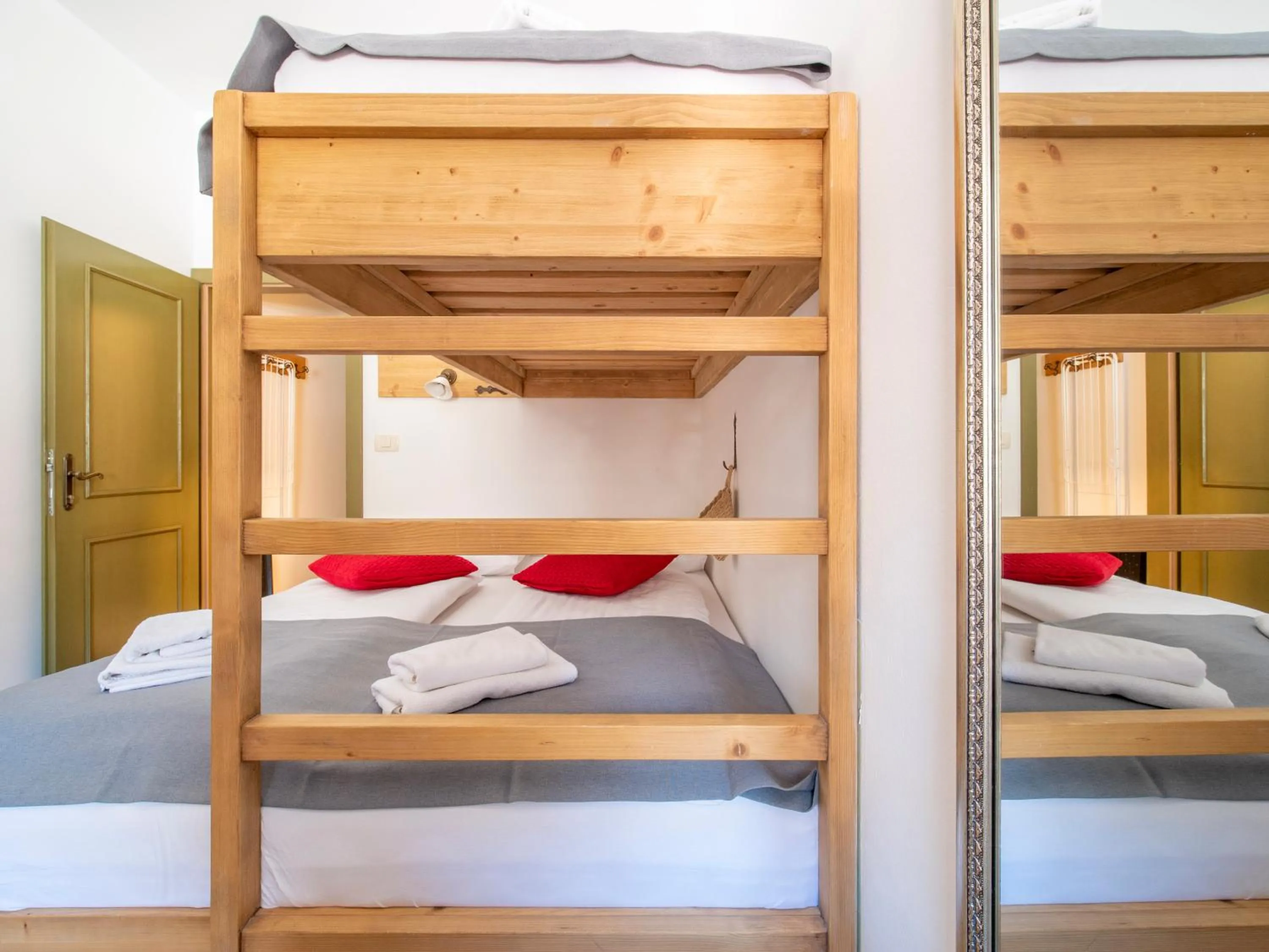 Bed in Berghi Hotel and Apartments