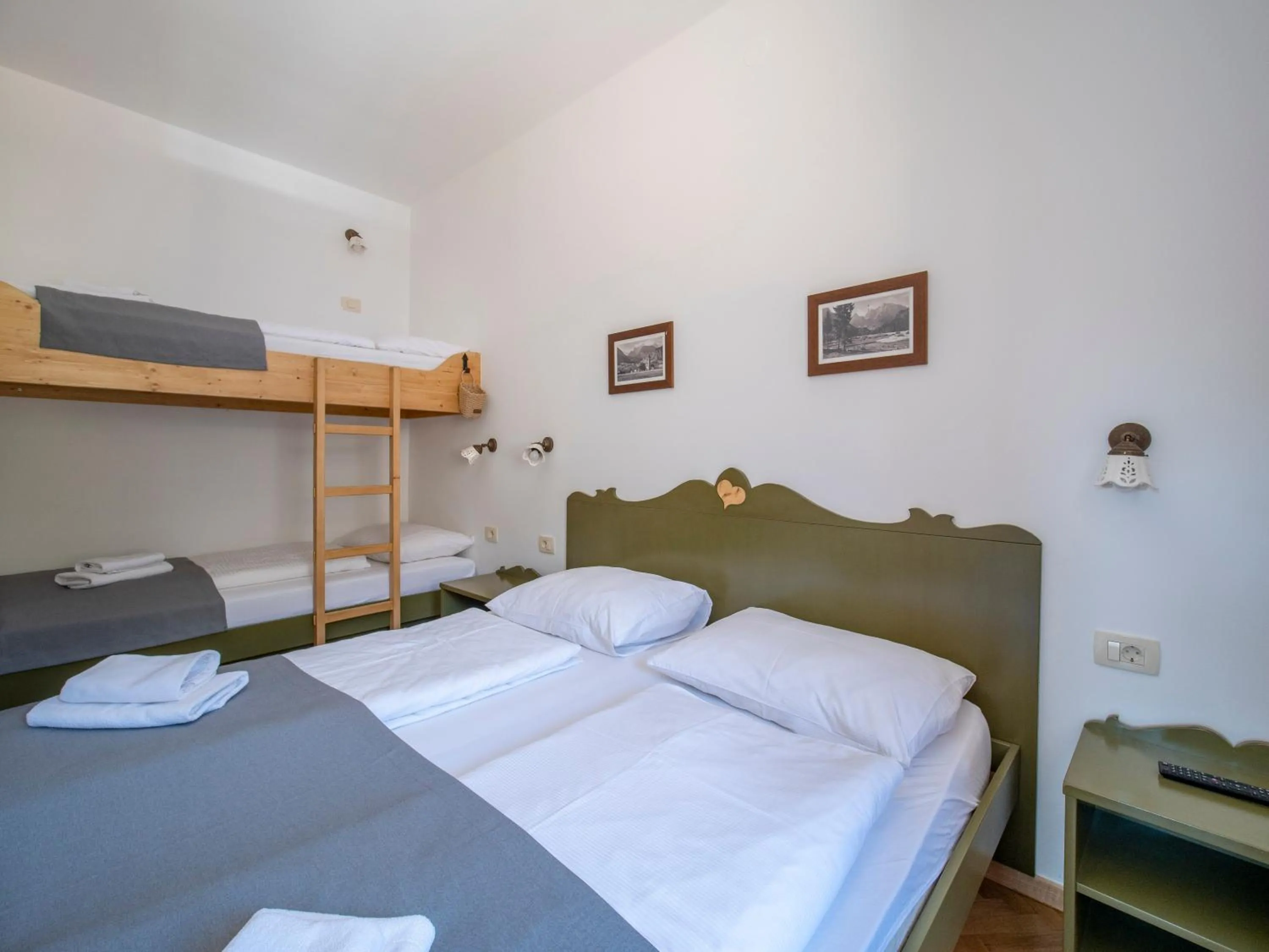 Bed in Berghi Hotel and Apartments