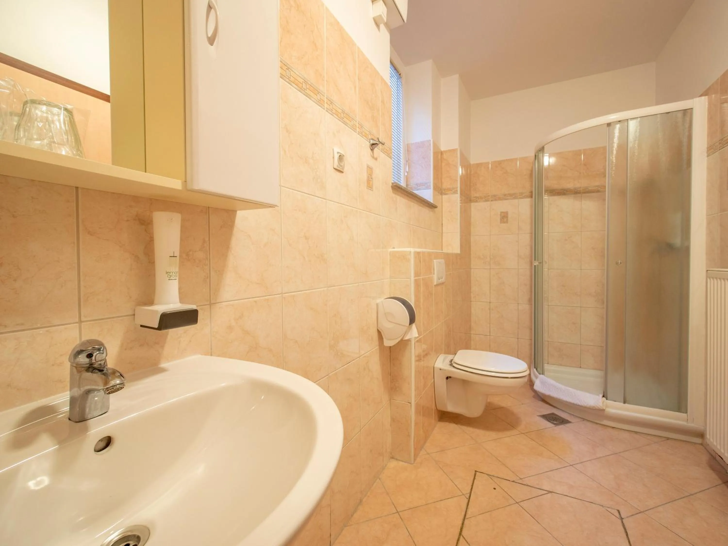 Bathroom in Berghi Hotel and Apartments