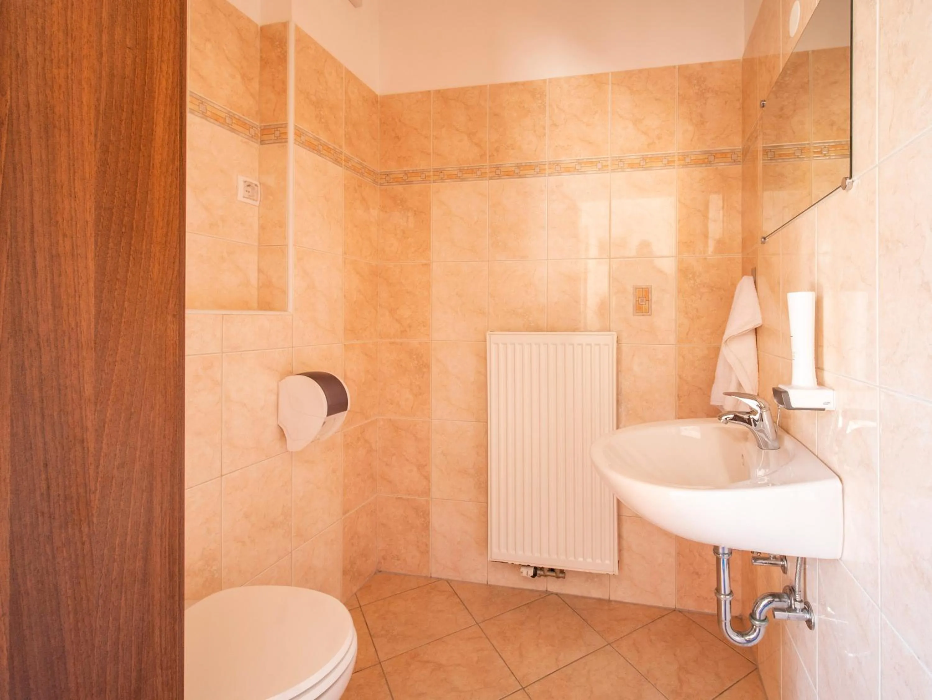 Bathroom in Berghi Hotel and Apartments