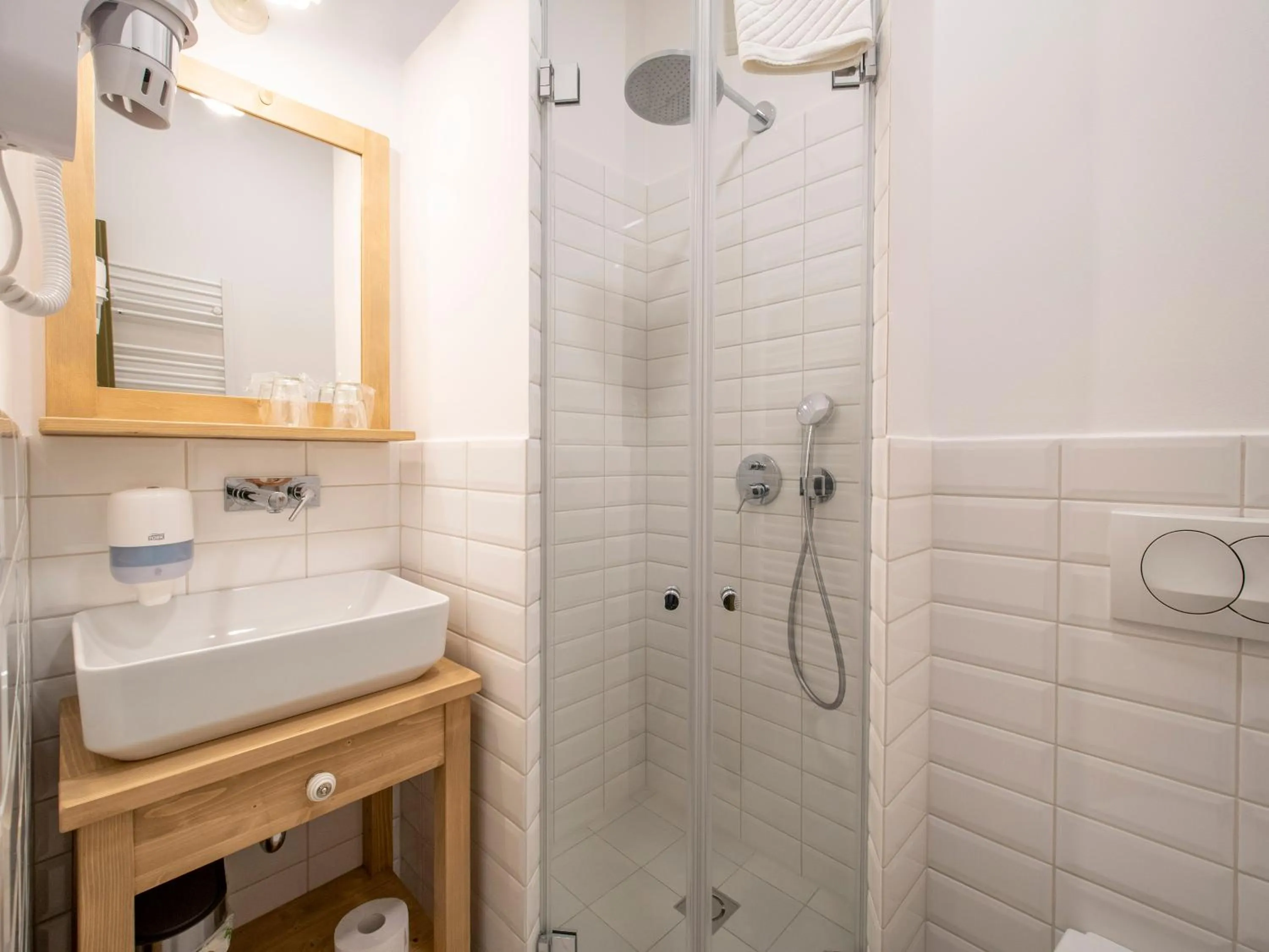 Bathroom in Berghi Hotel and Apartments