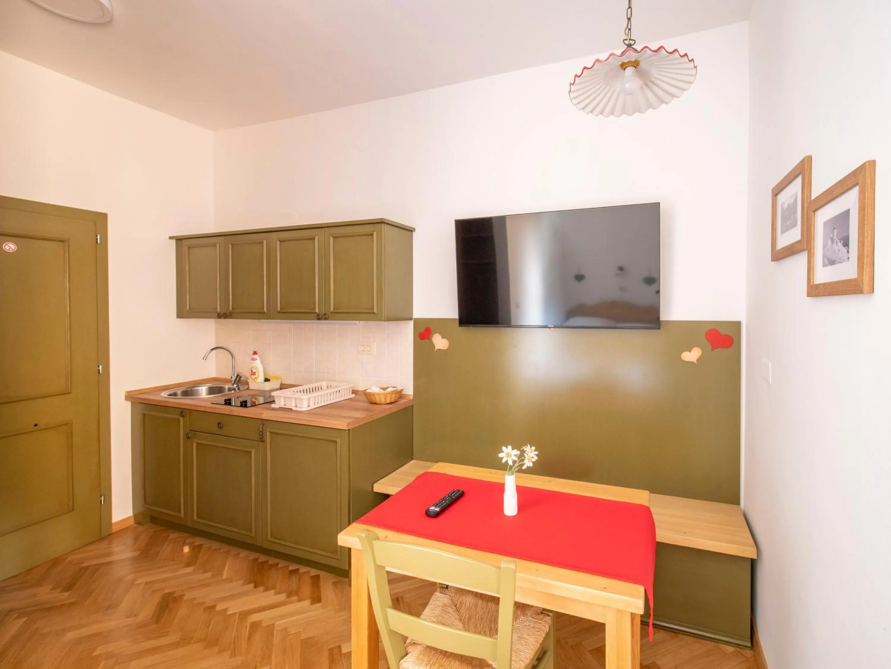 Kitchen or kitchenette in Berghi Hotel and Apartments