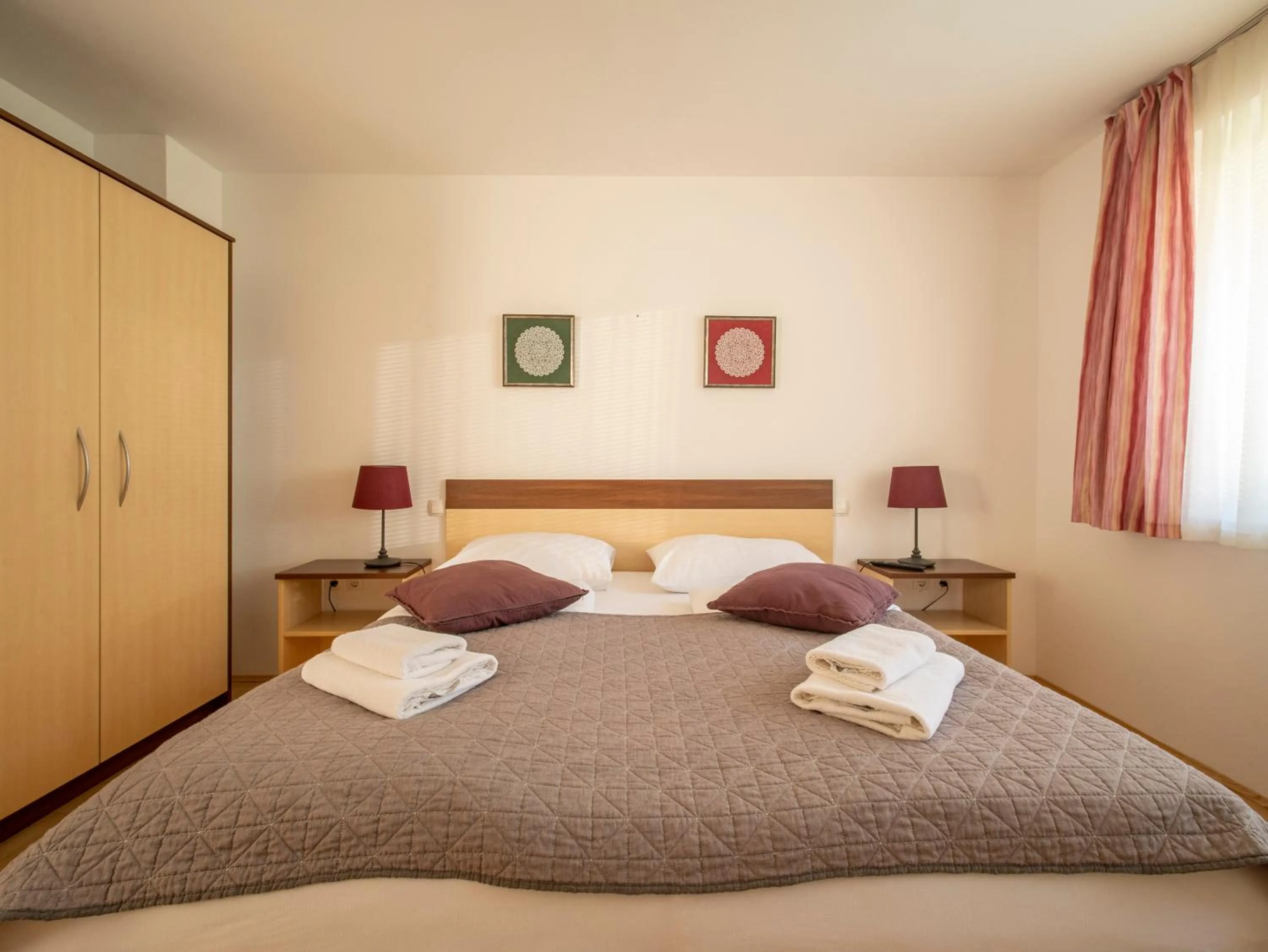 Bed in Berghi Hotel and Apartments