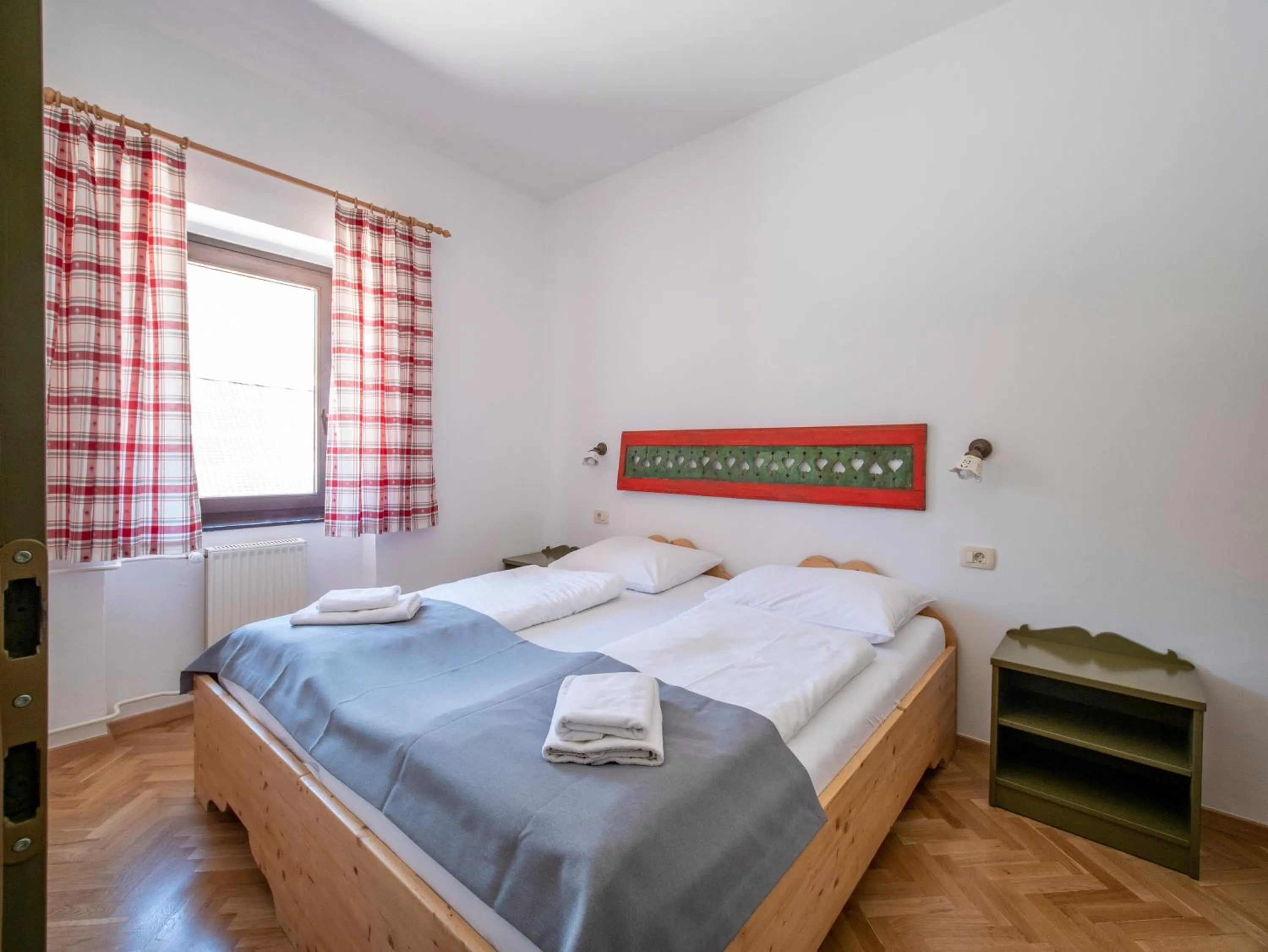 Bed in Berghi Hotel and Apartments