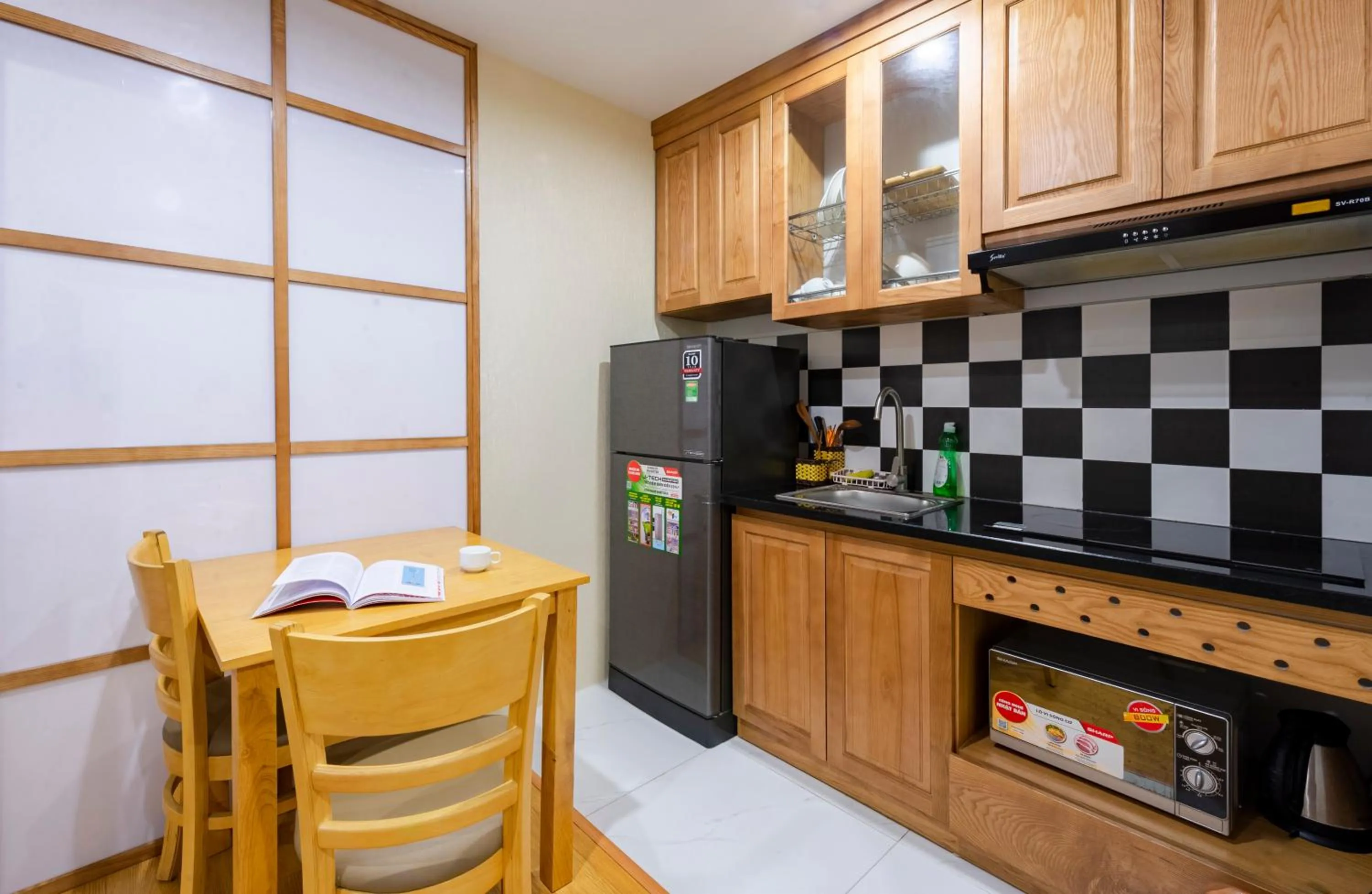 Kitchen or kitchenette in 22Housing luxury Hotel & Residence 39 Linh Lang