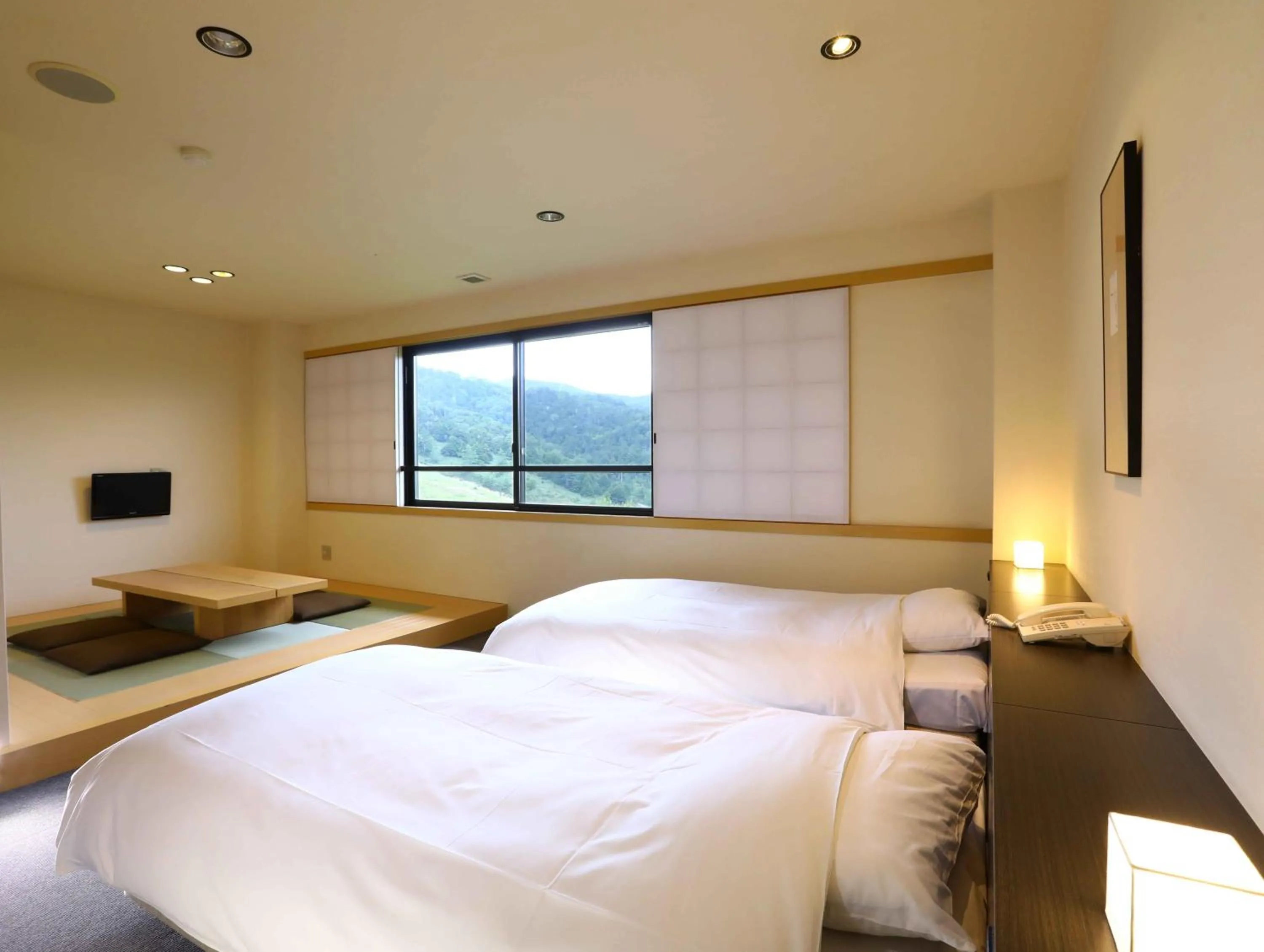 Photo of the whole room, Bed in Manza Onsen Nisshinkan