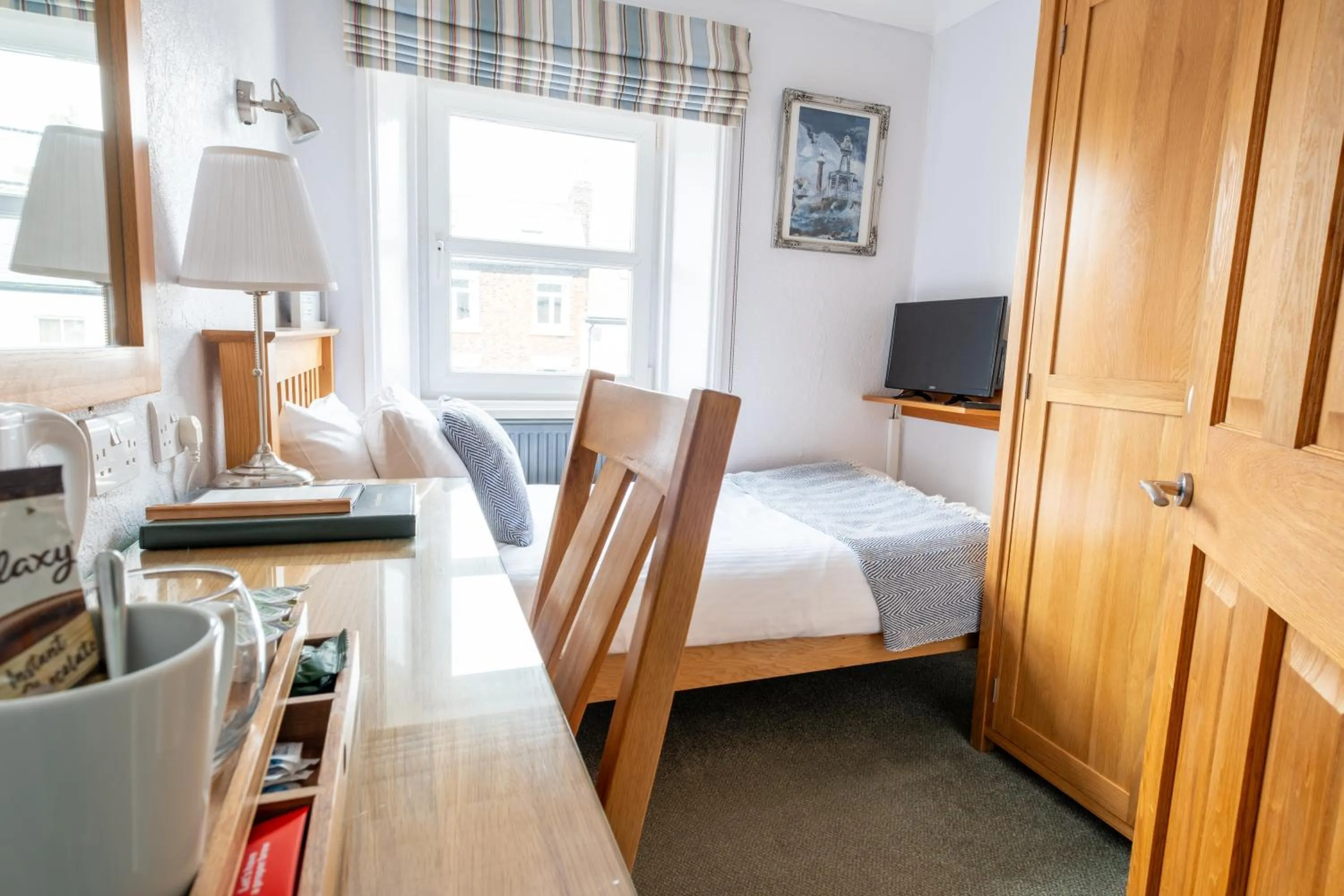 Photo of the whole room, Bed in Number 7 Guest House