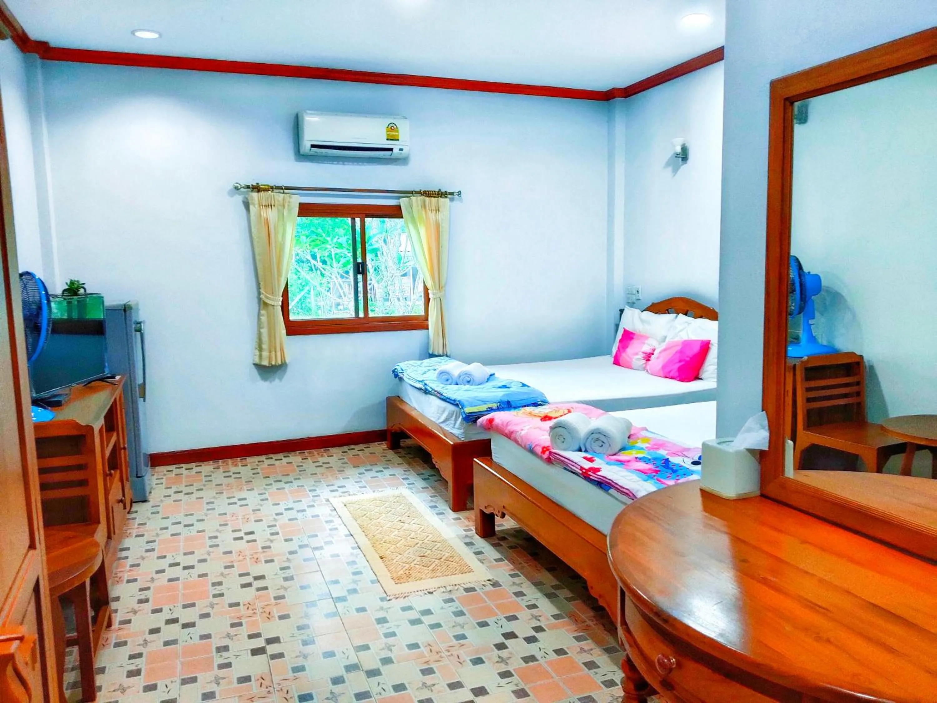 Bed in นาหินลาดรีสอร์ท Nahinlad Resort