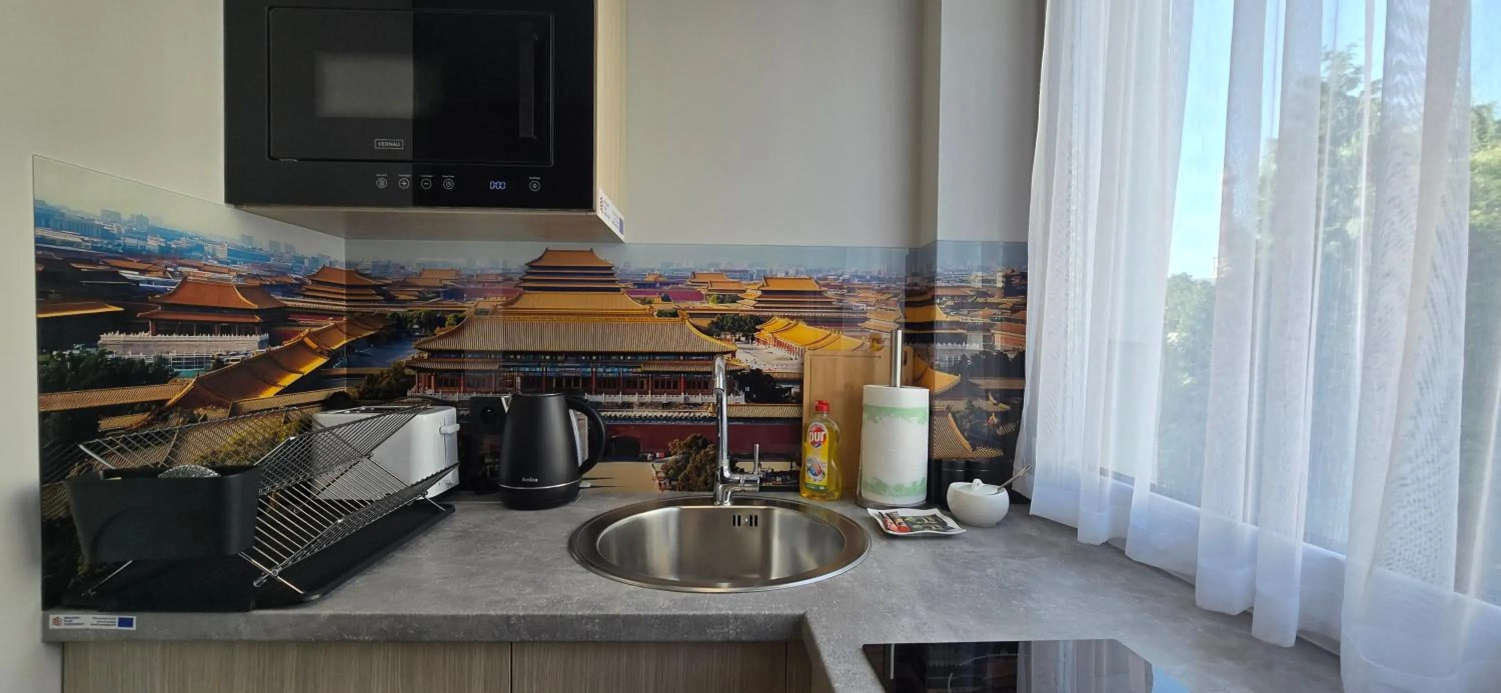 Kitchen or kitchenette in Metropolis Apartamenty Centrum