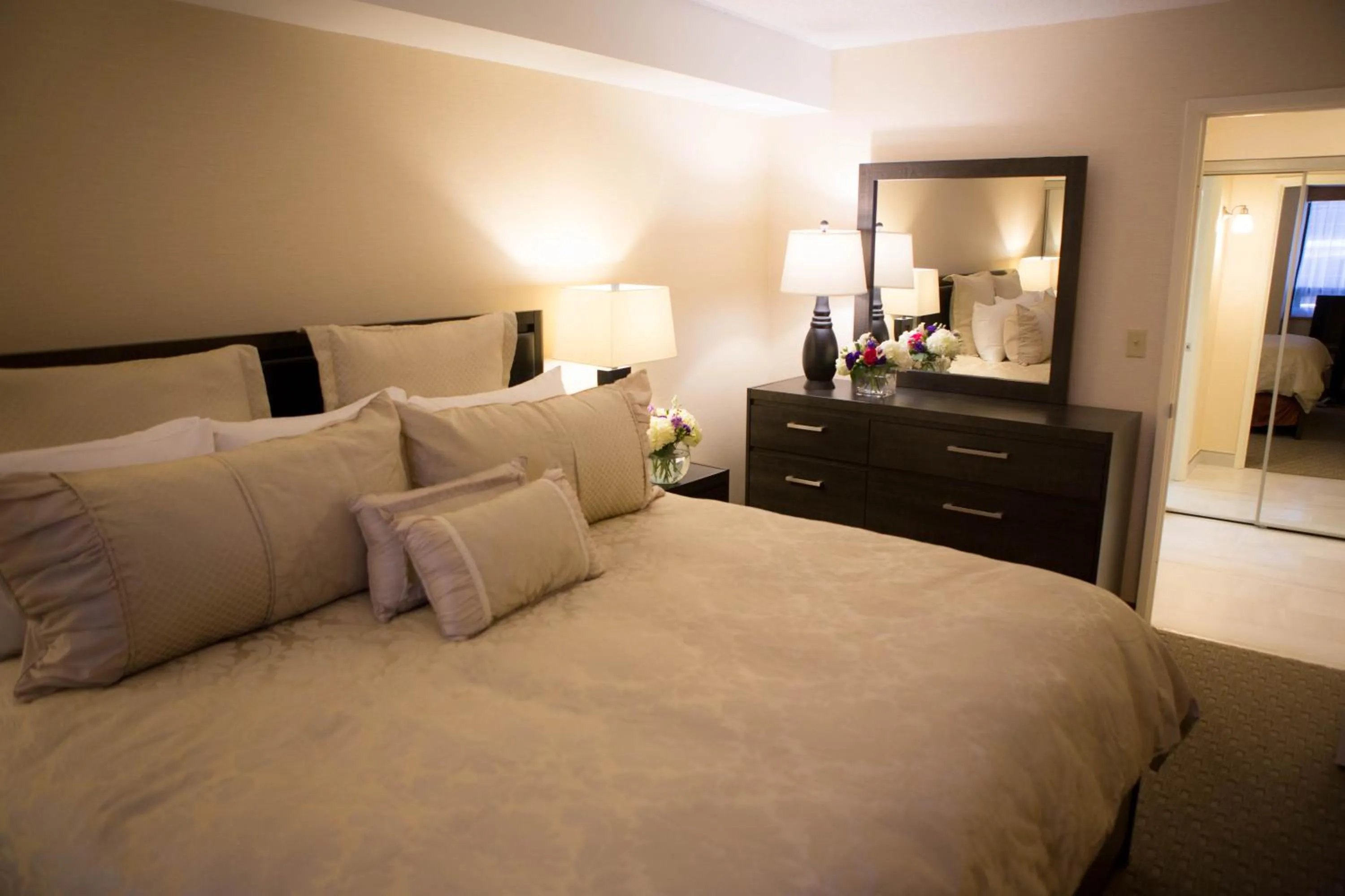 Bed in Cartier Place Suite Hotel