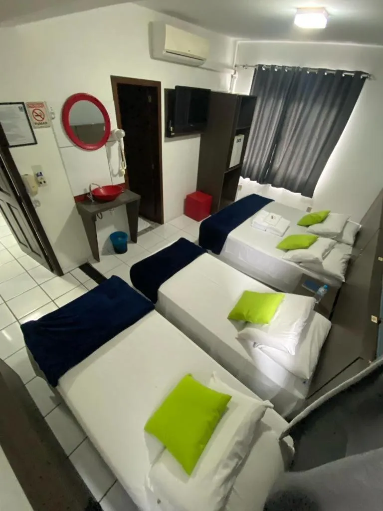 Photo of the whole room, Bed in Rezende Suítes