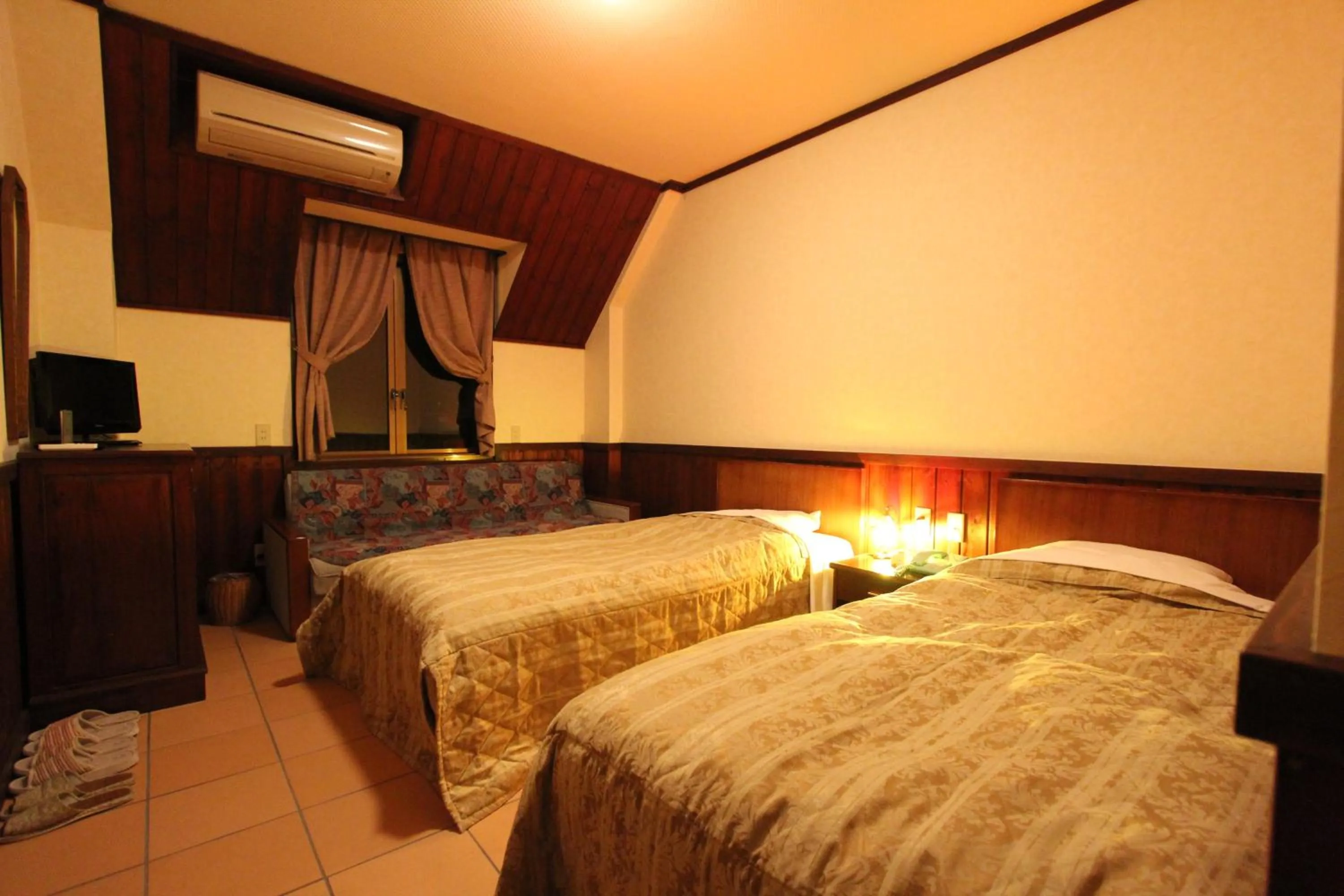 Bed in Matsushima Petit Hotel Bistro Abalon