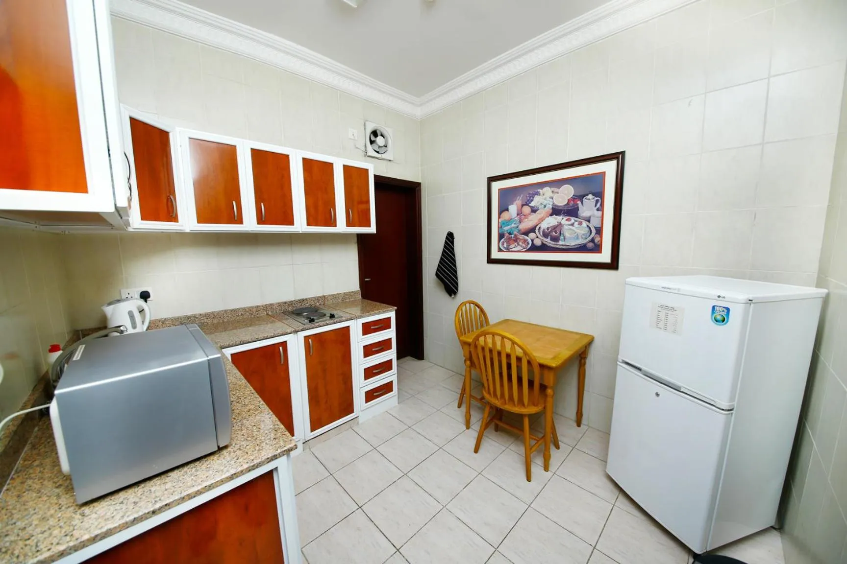 Kitchen or kitchenette in Muscat International Hotel