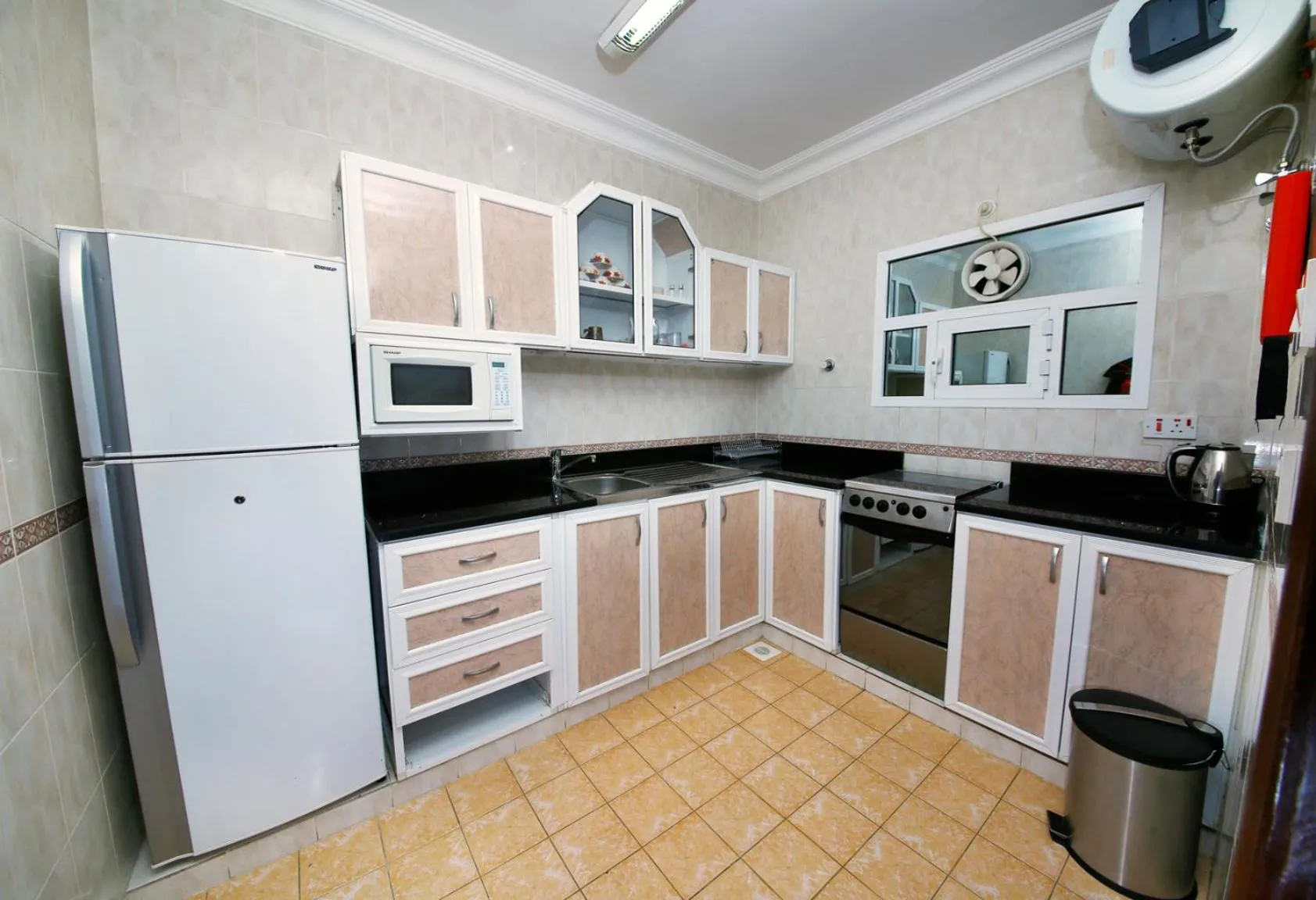 Kitchen or kitchenette in Muscat International Hotel