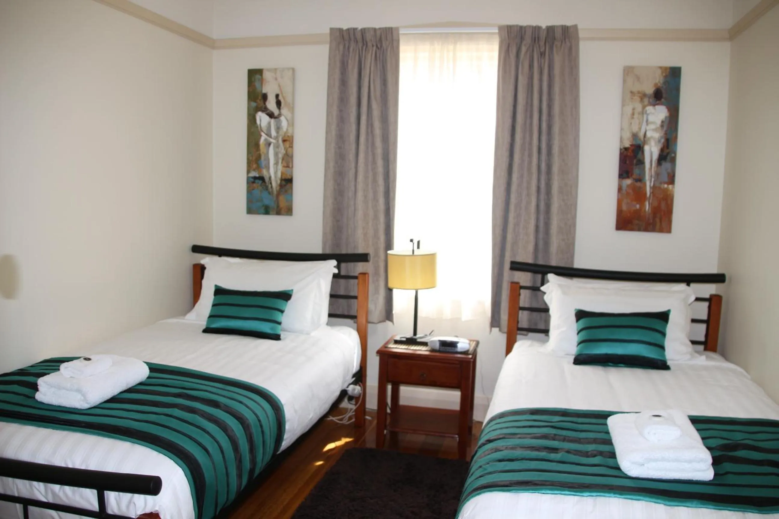 Toilet, Bed in Moonah Central Apartments