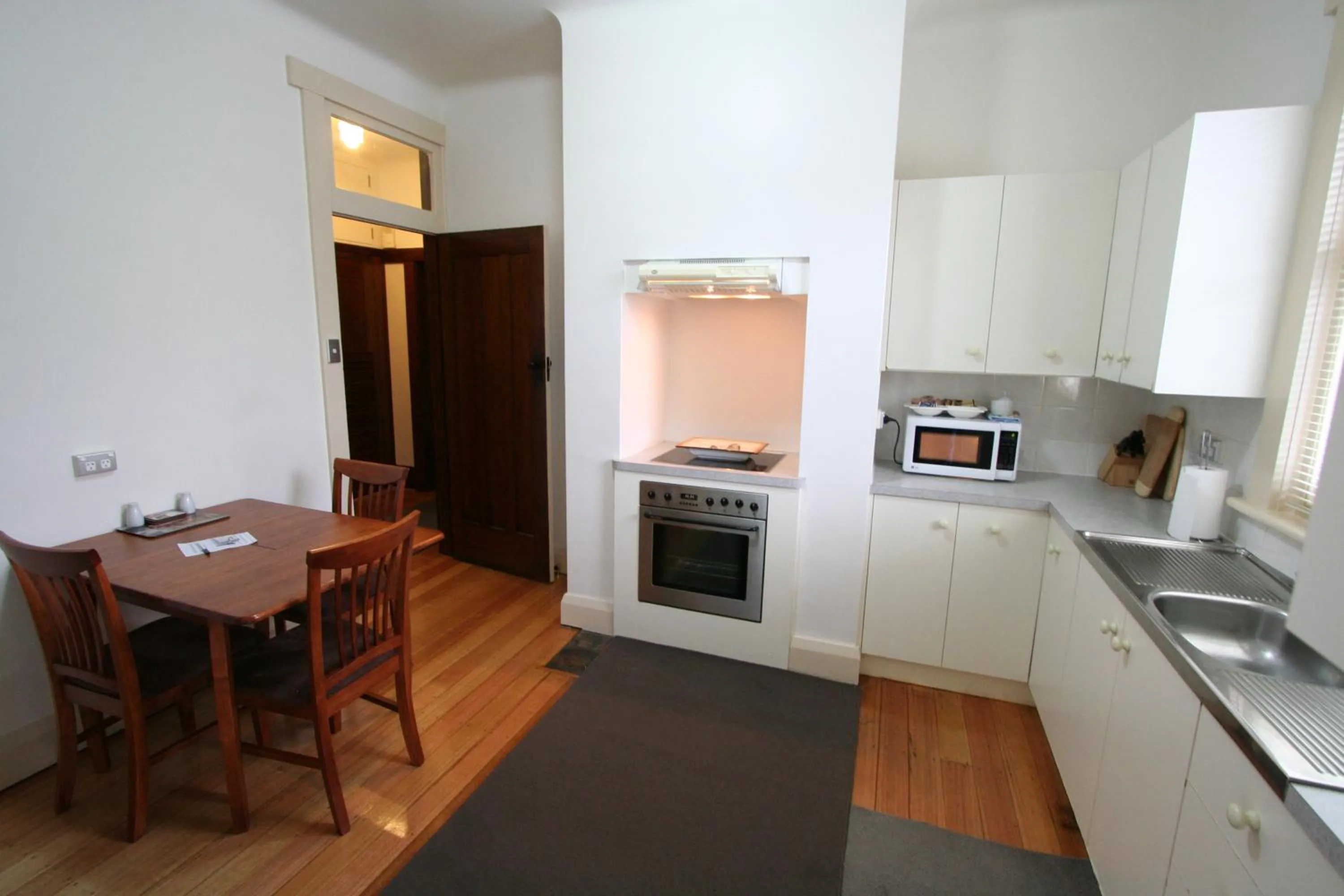 Kitchen or kitchenette in Moonah Central Apartments