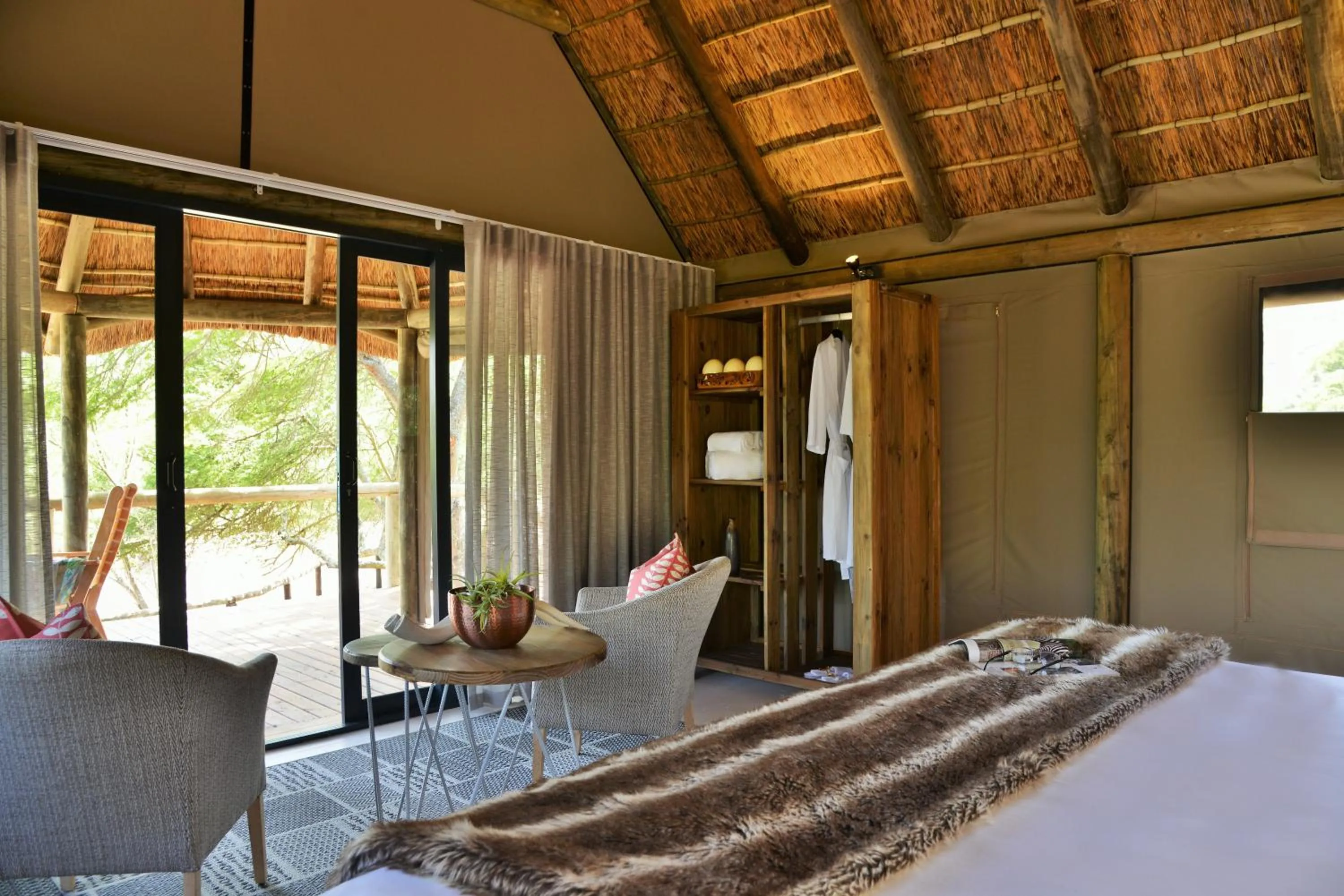 Seating area, Bed in Garden Route Safari Camp