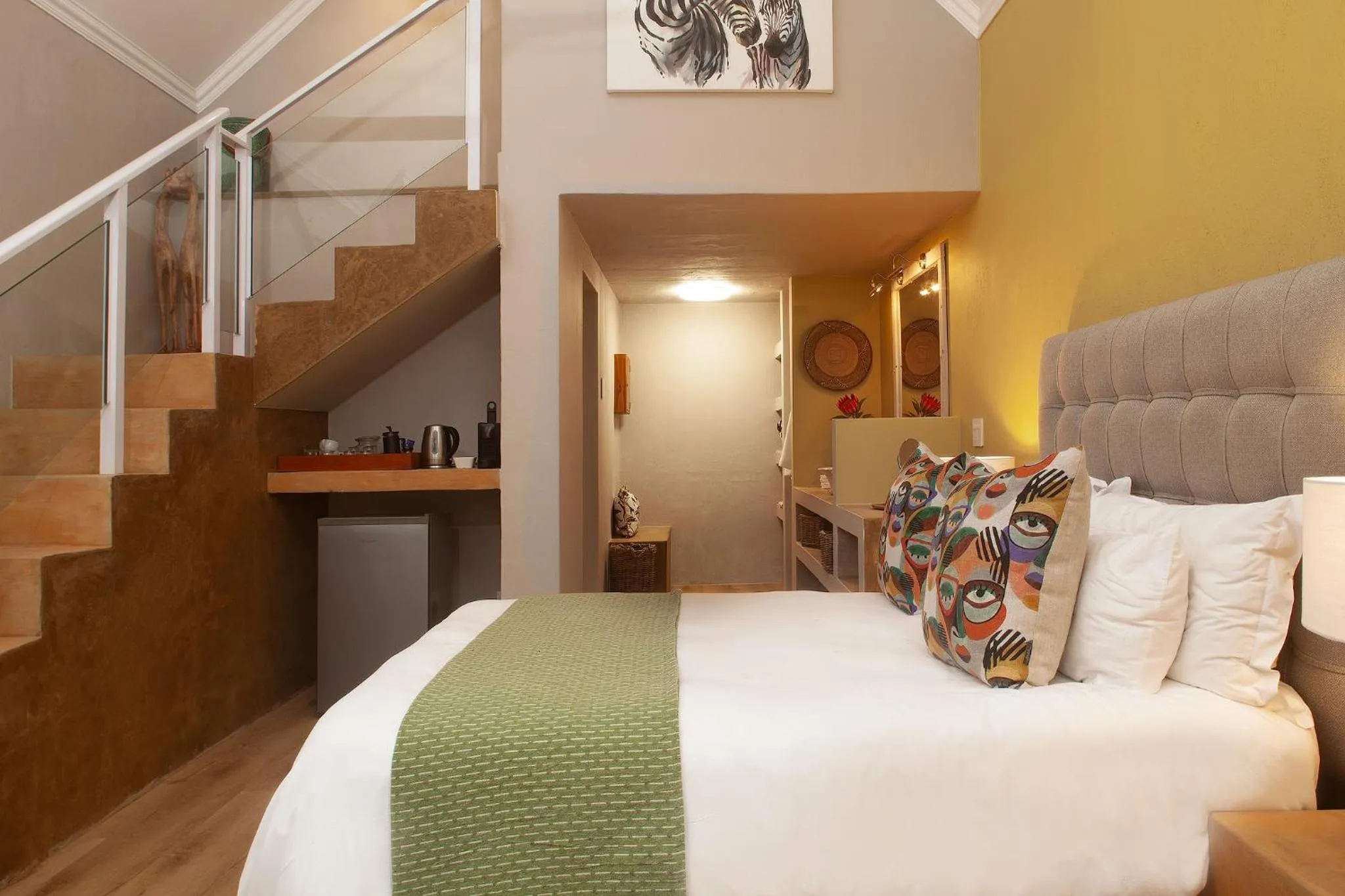 Bed in Garden Route Safari Camp