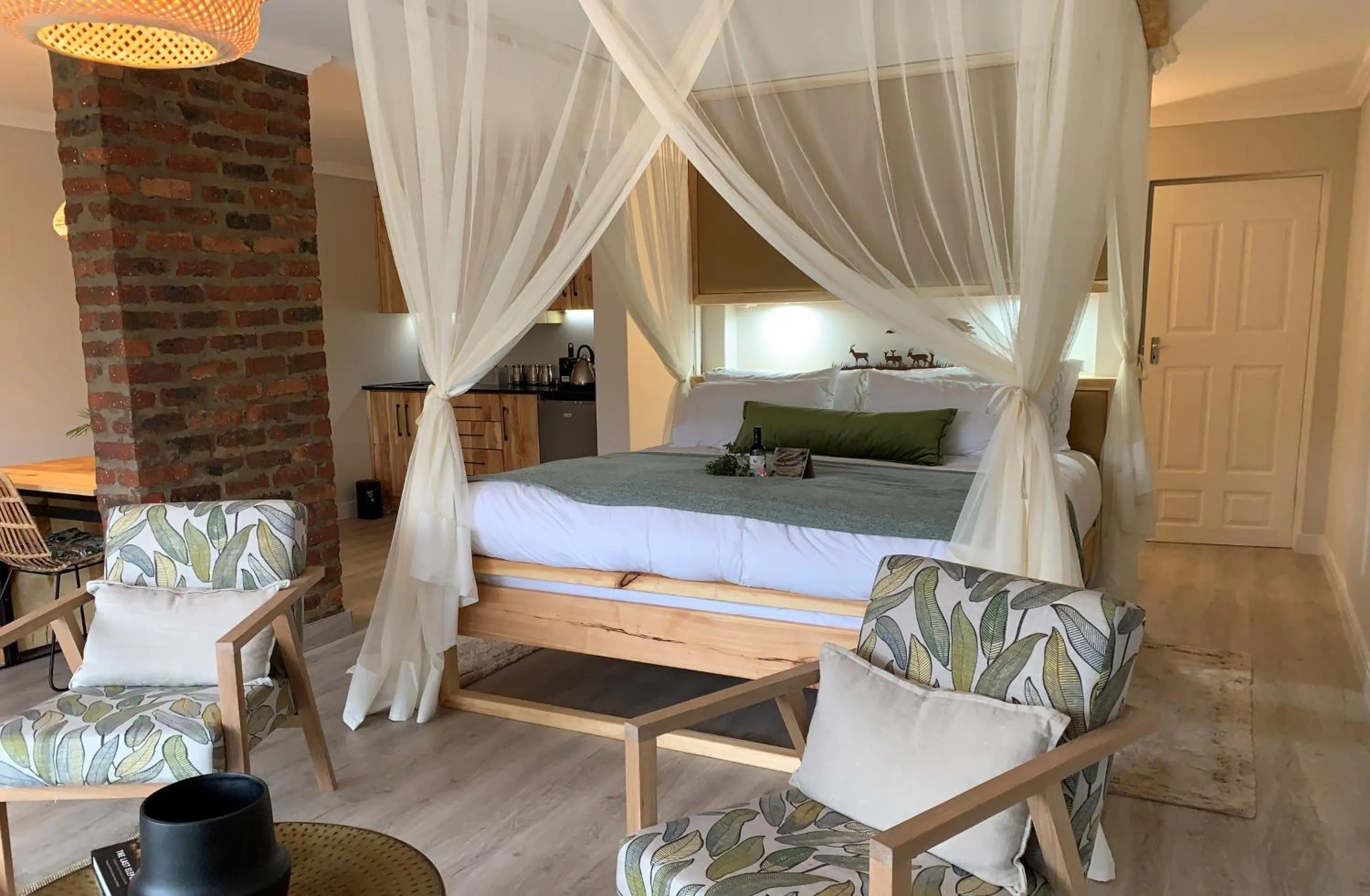 Bed in Garden Route Safari Camp