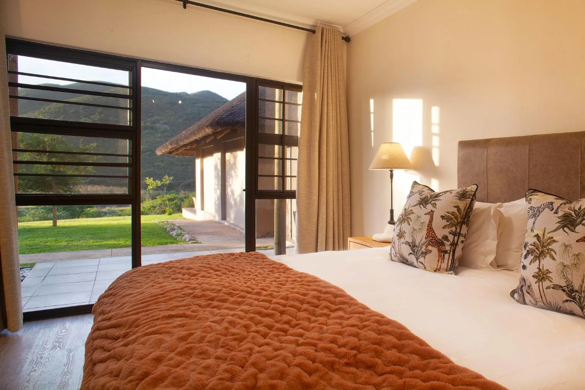 Bed in Garden Route Safari Camp