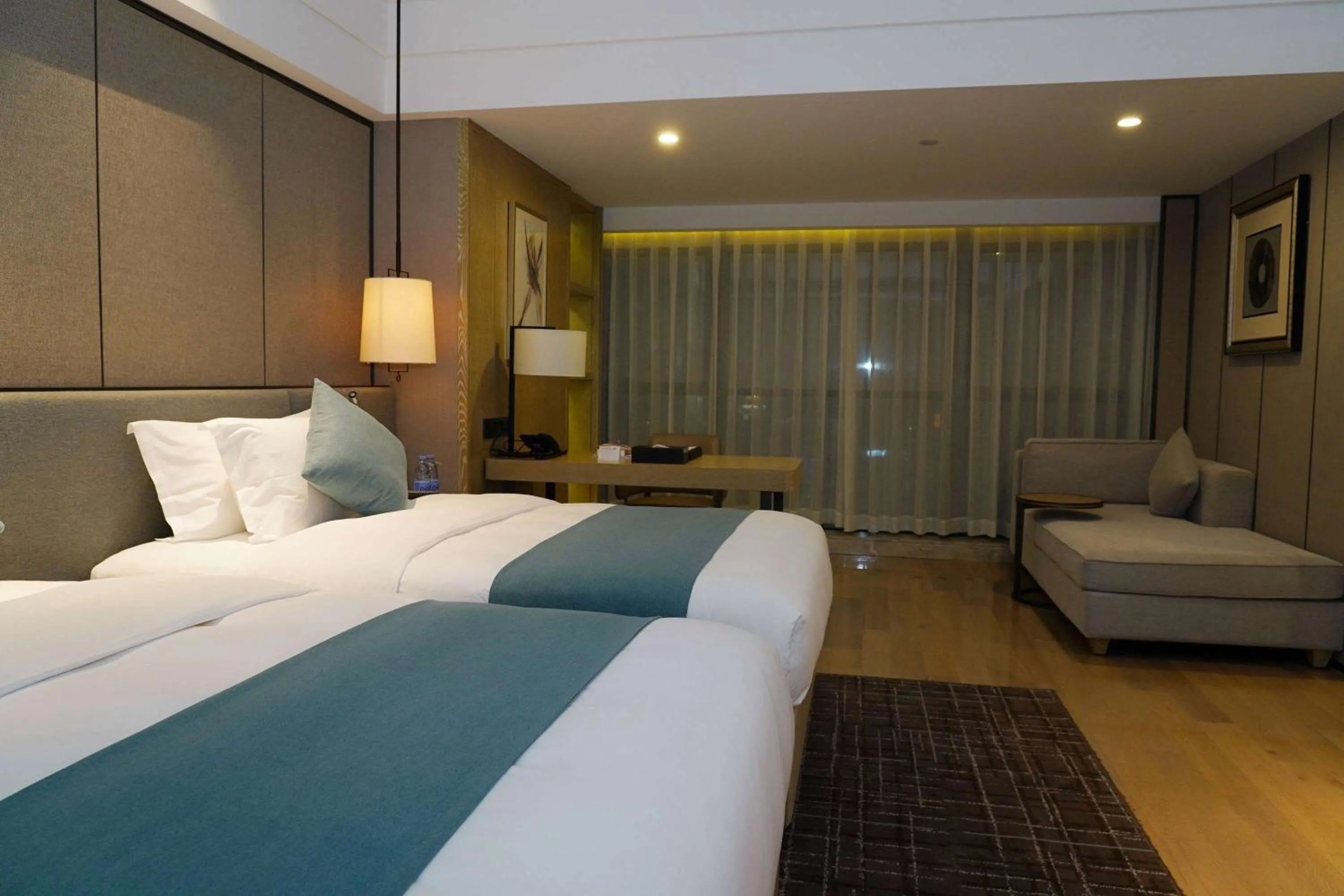 Photo of the whole room, Bed in Wyndham Grand Maoming